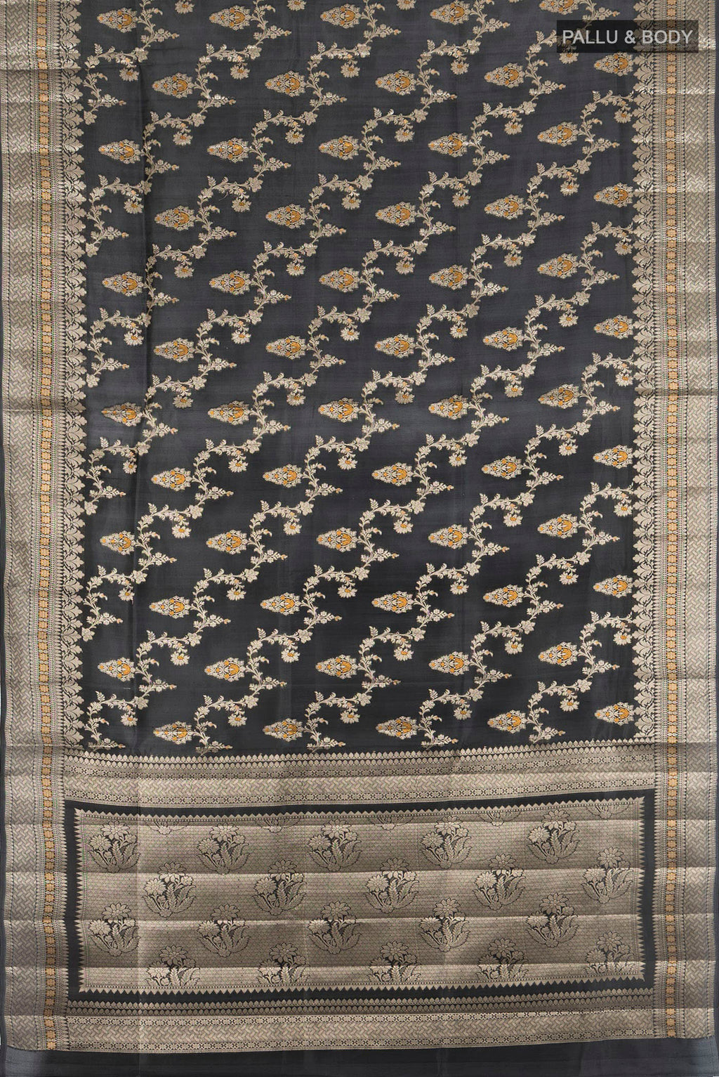 Flat view of Black Banarasi Raw Silk Saree with Zari And Thread Butta on the body and Zari Border. 