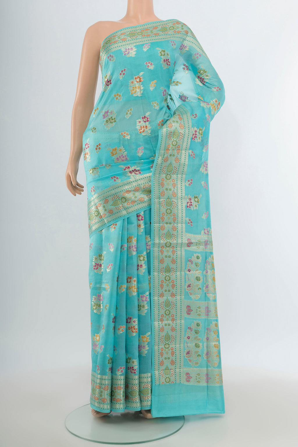 Sky Blue Banarasi Raw Silk Saree with Zari And Thread Butta on the body and Zari Border.  displayed on a mannequin