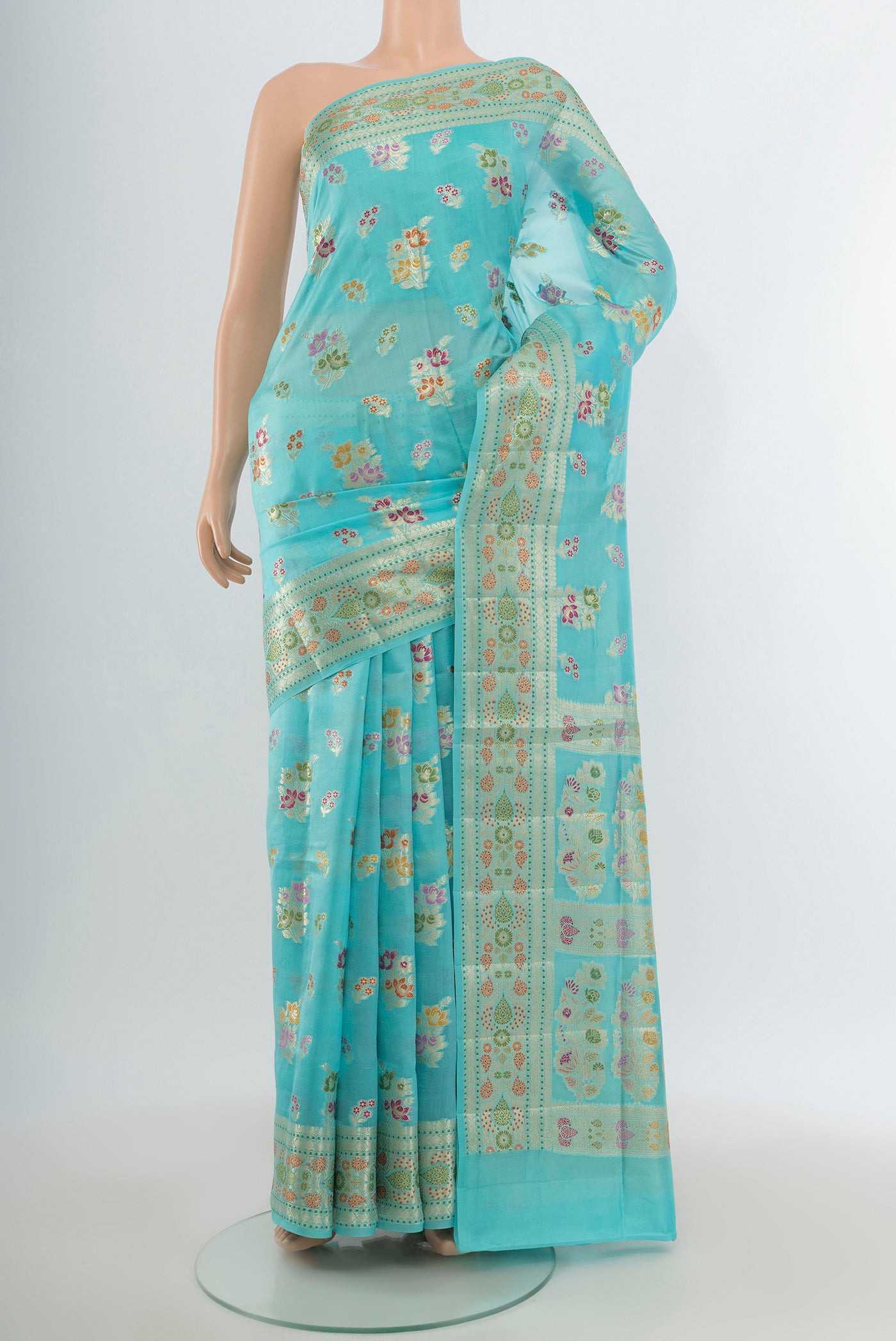 Sky Blue Banarasi Raw Silk Saree with Zari And Thread Butta on the body and Zari Border.  displayed on a mannequin
