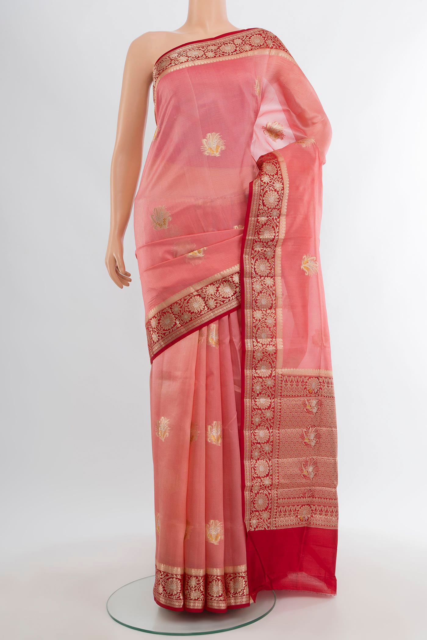 Coral Banarasi Raw Silk Saree with Zari Butta on the body and Zari Border.  displayed on a mannequin
