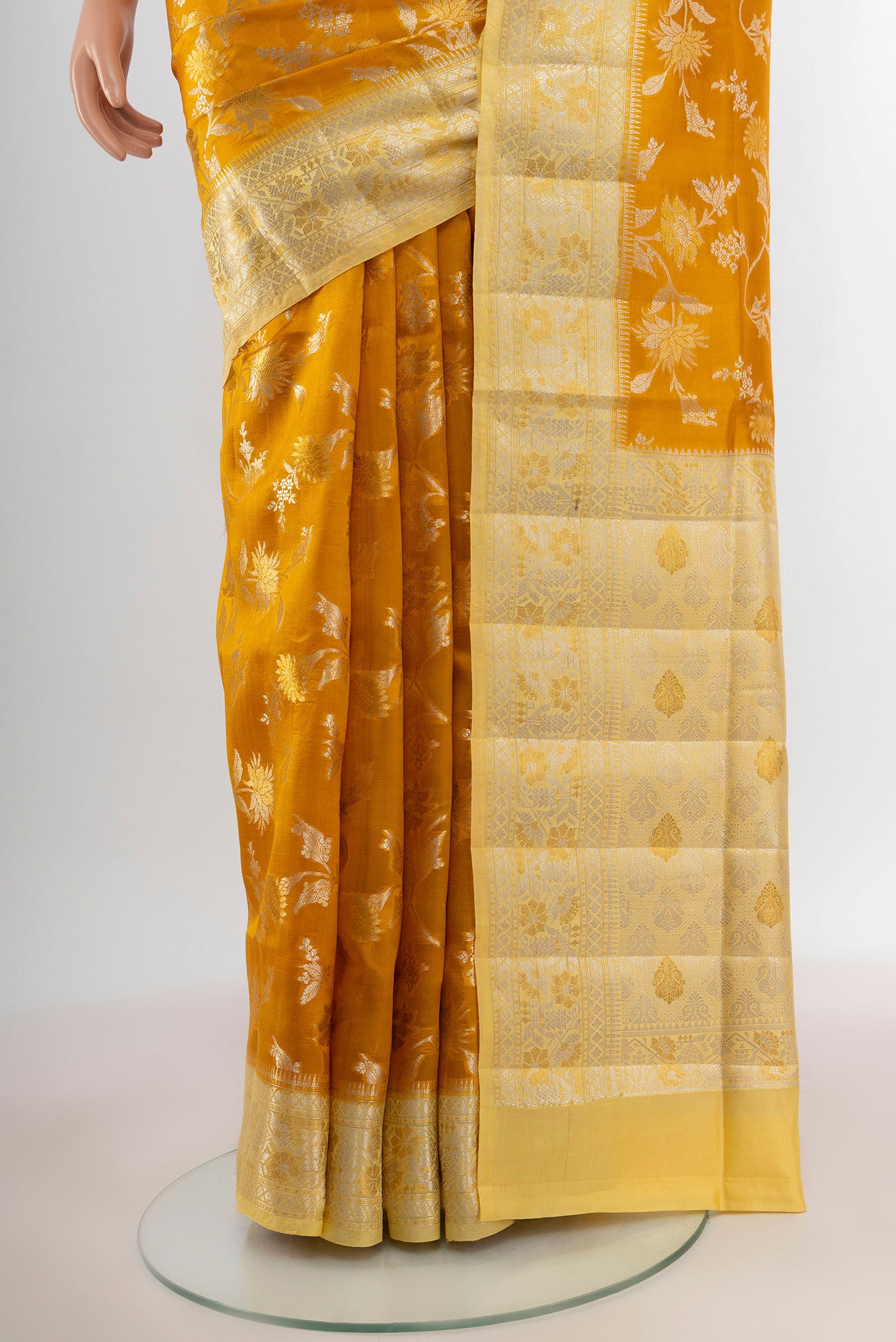 Pleats and pallu of Yellow Banarasi Raw Silk Saree with Zari Butta on the body and Zari Border. 