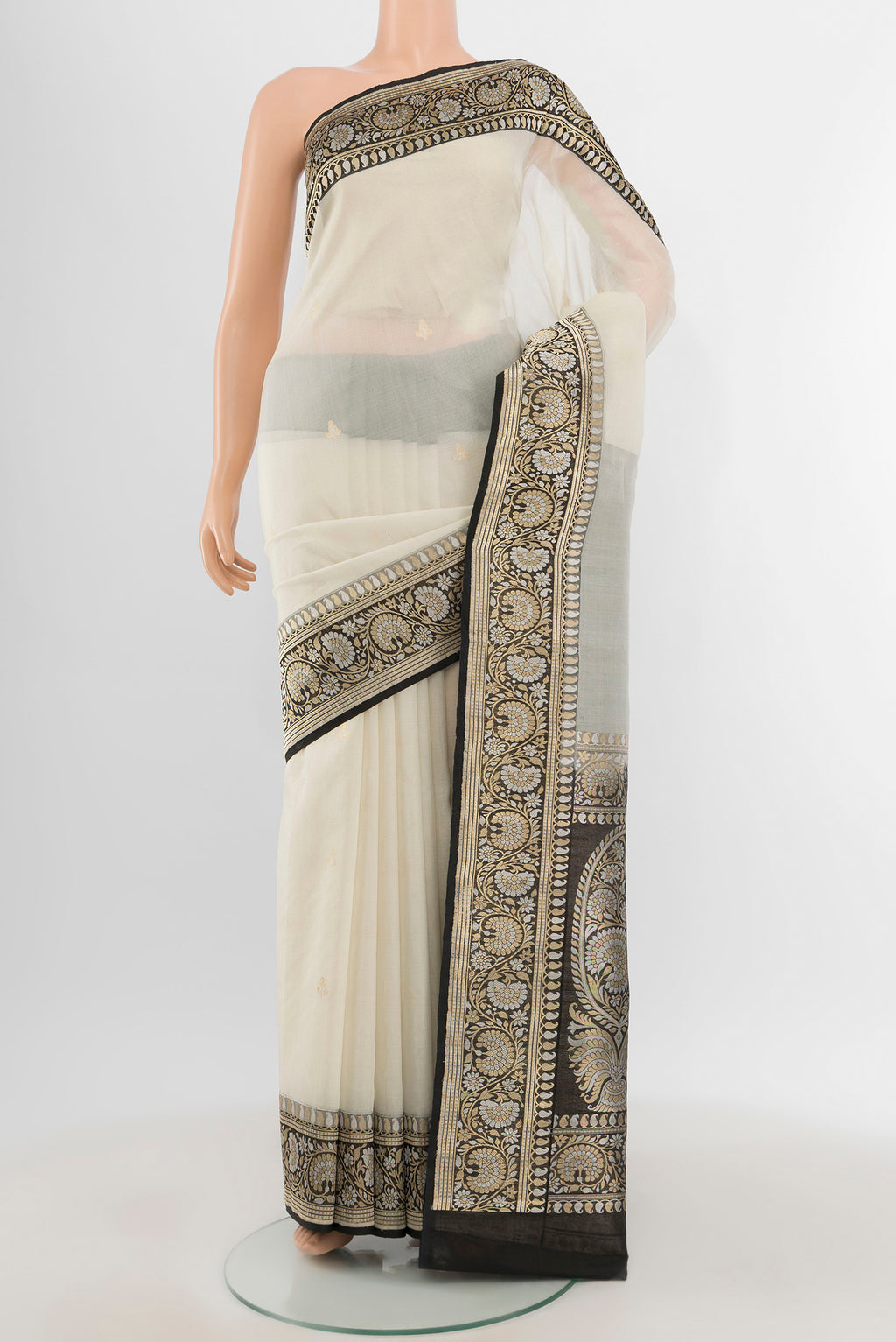 White Banarasi Kora Silk Saree with Zari Butta on the body and Zari Border.  displayed on a mannequin