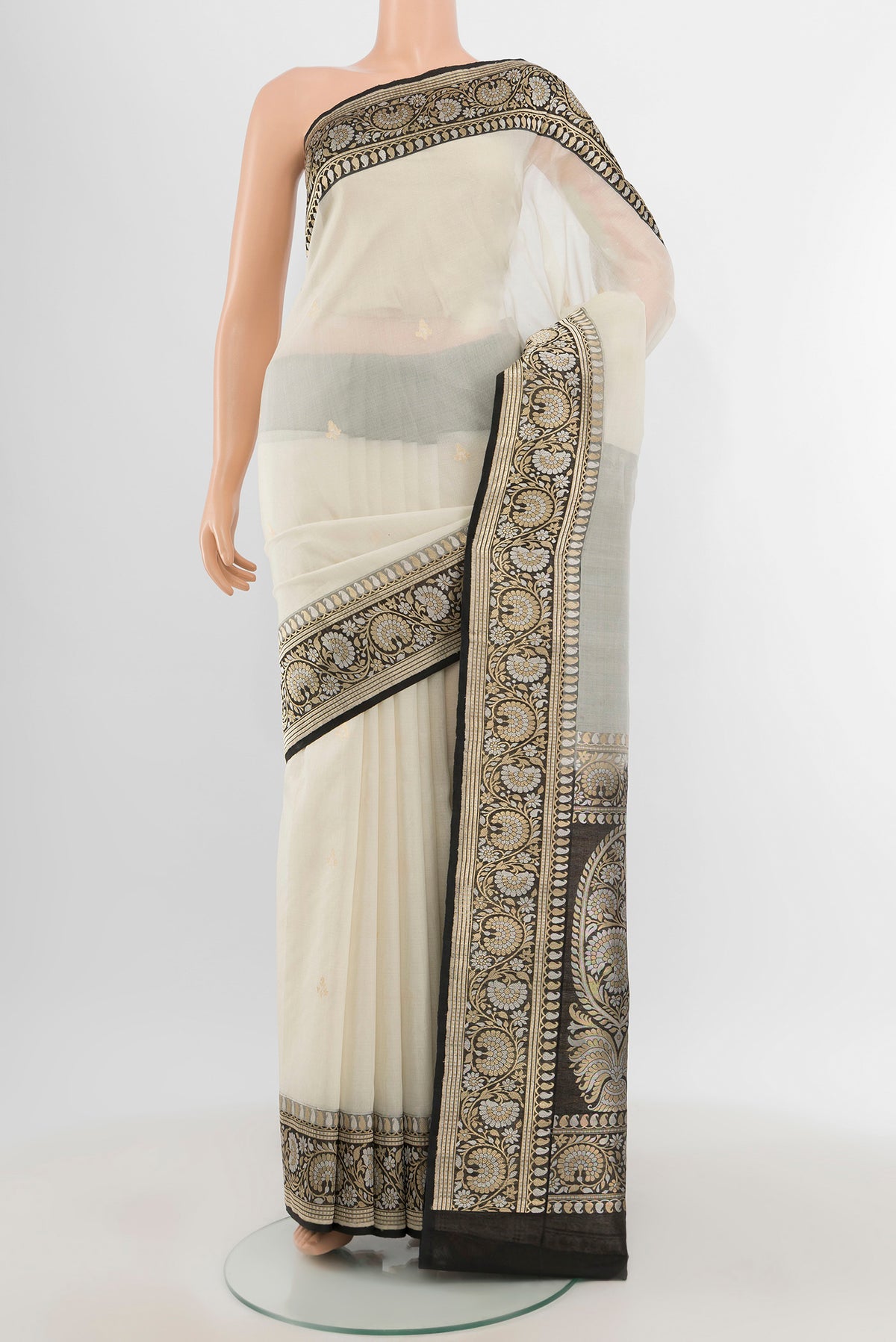 White Banarasi Kora Silk Saree with Zari Butta on the body and Zari Border.  displayed on a mannequin
