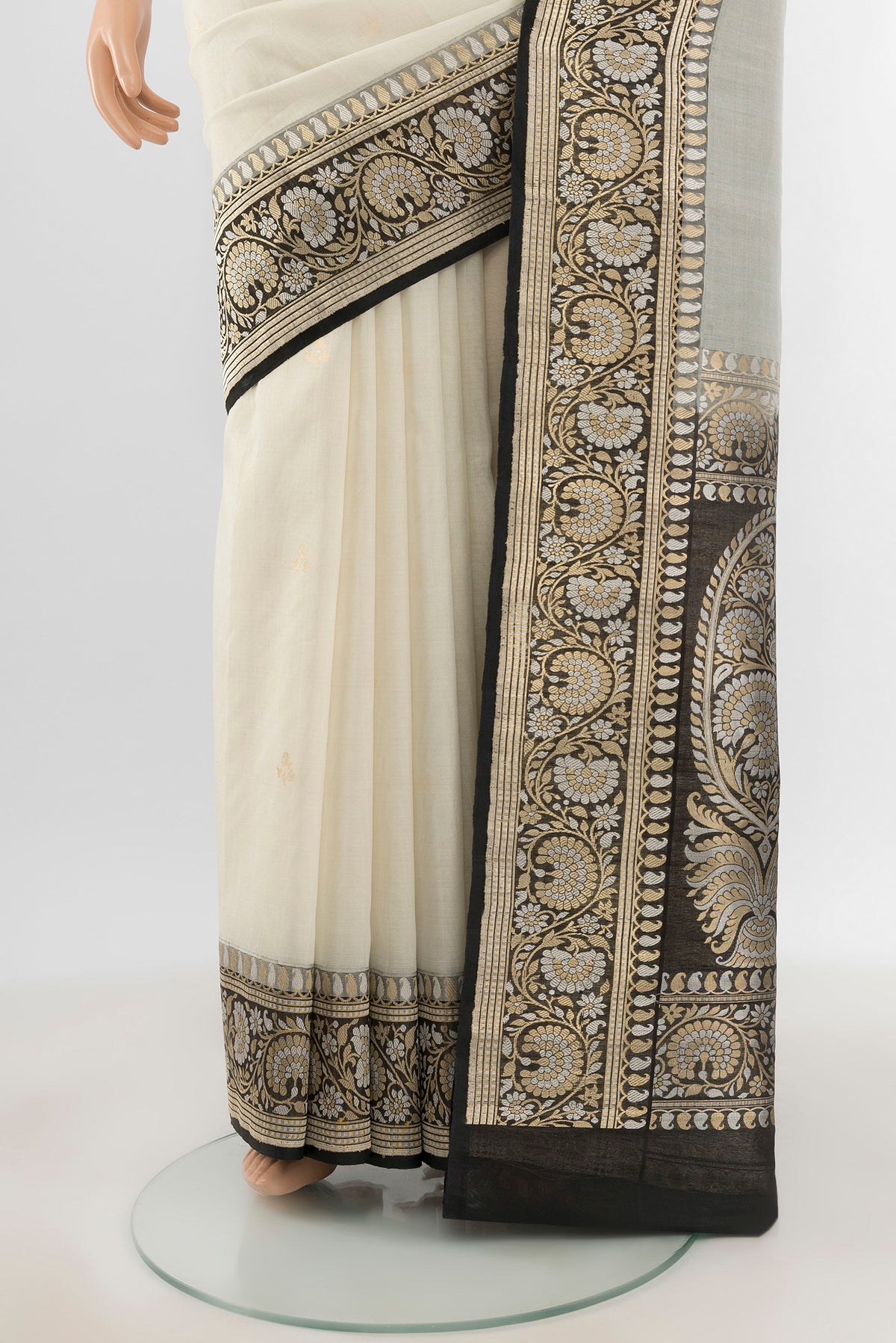 Pleats and pallu of White Banarasi Kora Silk Saree with Zari Butta on the body and Zari Border. 