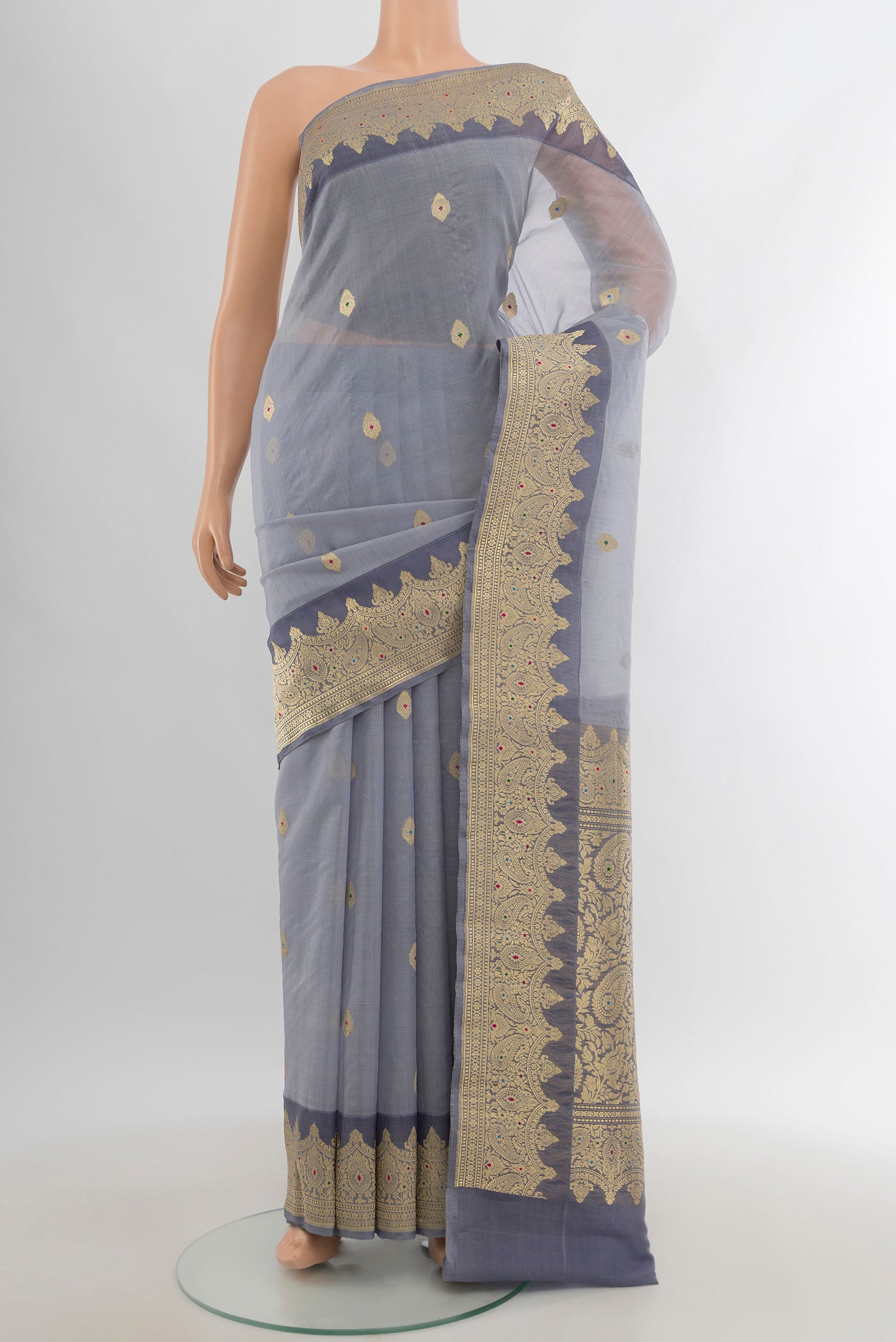 Davys Grey Banarasi Kora Silk Saree with Zari Butta on the body and Zari Border.  displayed on a mannequin