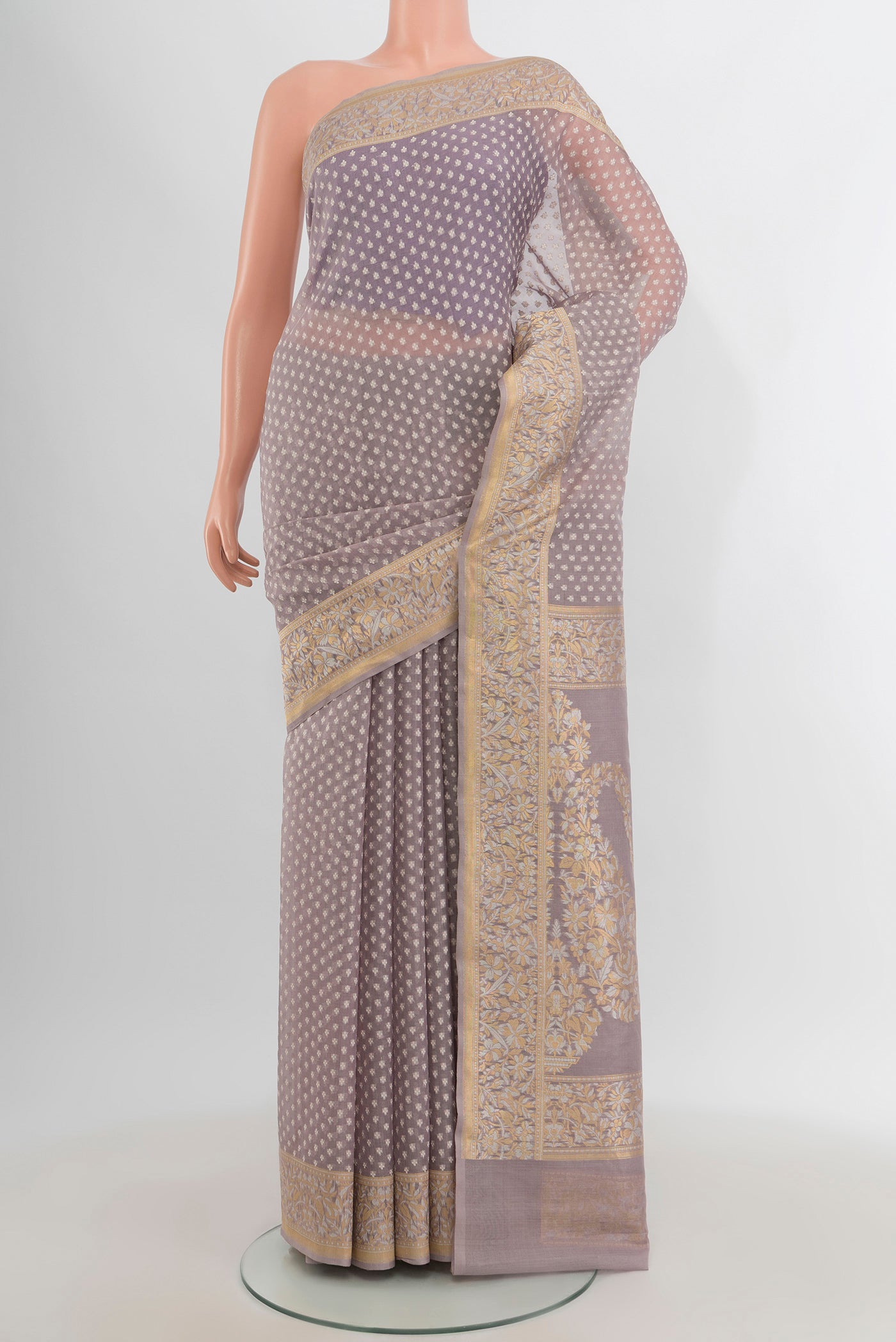 Lilac Banarasi Kora Silk Saree with Zari Butta on the body and Zari Border.  displayed on a mannequin