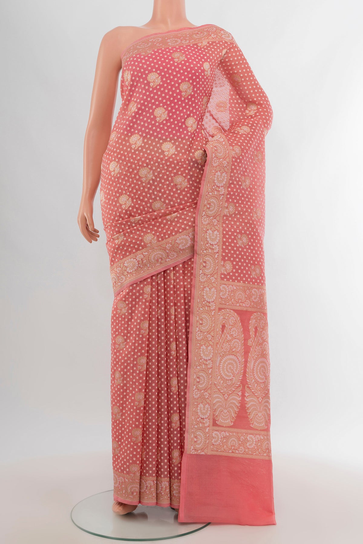 Rose pink Banarasi Kora Silk Saree with Zari Butta on the body and Zari Border.  displayed on a mannequin