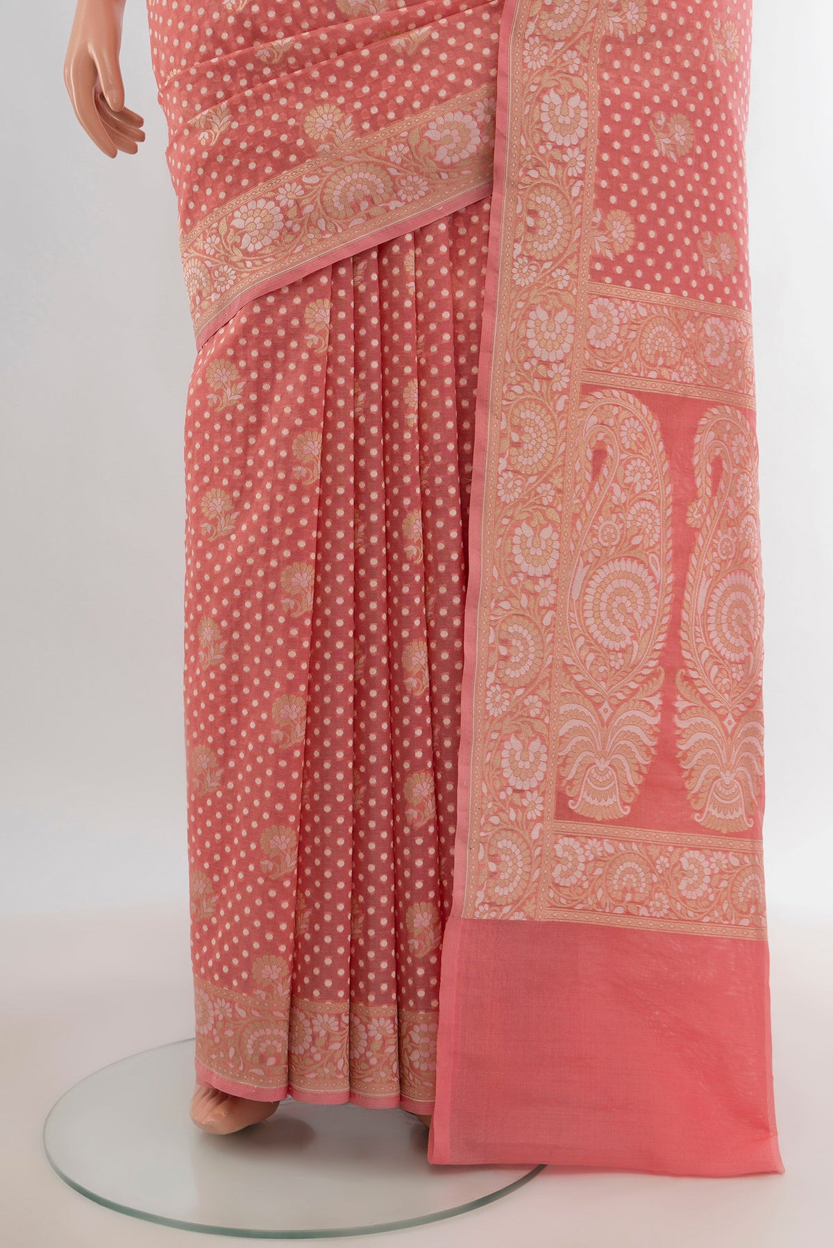 Pleats and pallu of Rose pink Banarasi Kora Silk Saree with Zari Butta on the body and Zari Border. 