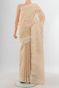 Cream Banarasi Kora Silk Saree with Zari And Thread Butta on the body and Zari Border.  displayed on a mannequin