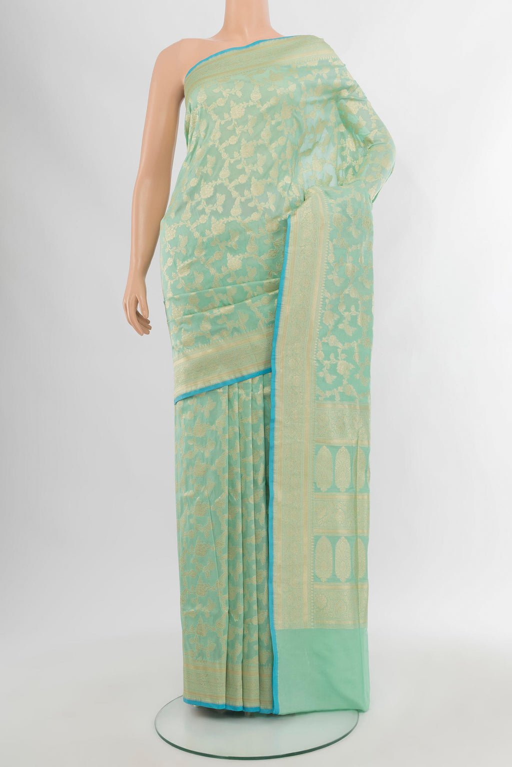 Light Blue Banarasi Silk Saree with Zari Brocade on the body and Zari Border.  displayed on a mannequin