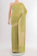 Pure Silk Pure Zari Light Green Banarasi Saree with Zari Butta on the body and Silk Border.  displayed on a mannequin