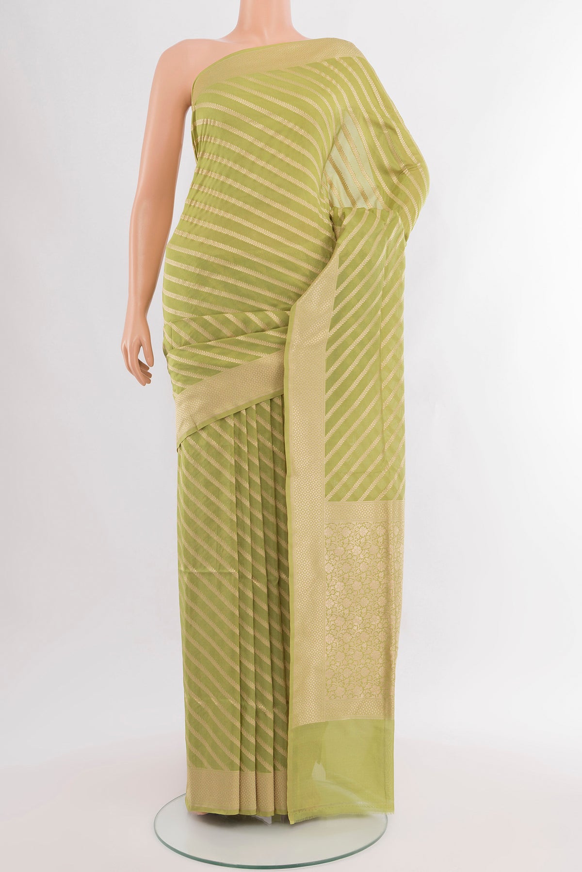 Pure Silk Pure Zari Light Green Banarasi Saree with Zari Butta on the body and Silk Border.  displayed on a mannequin