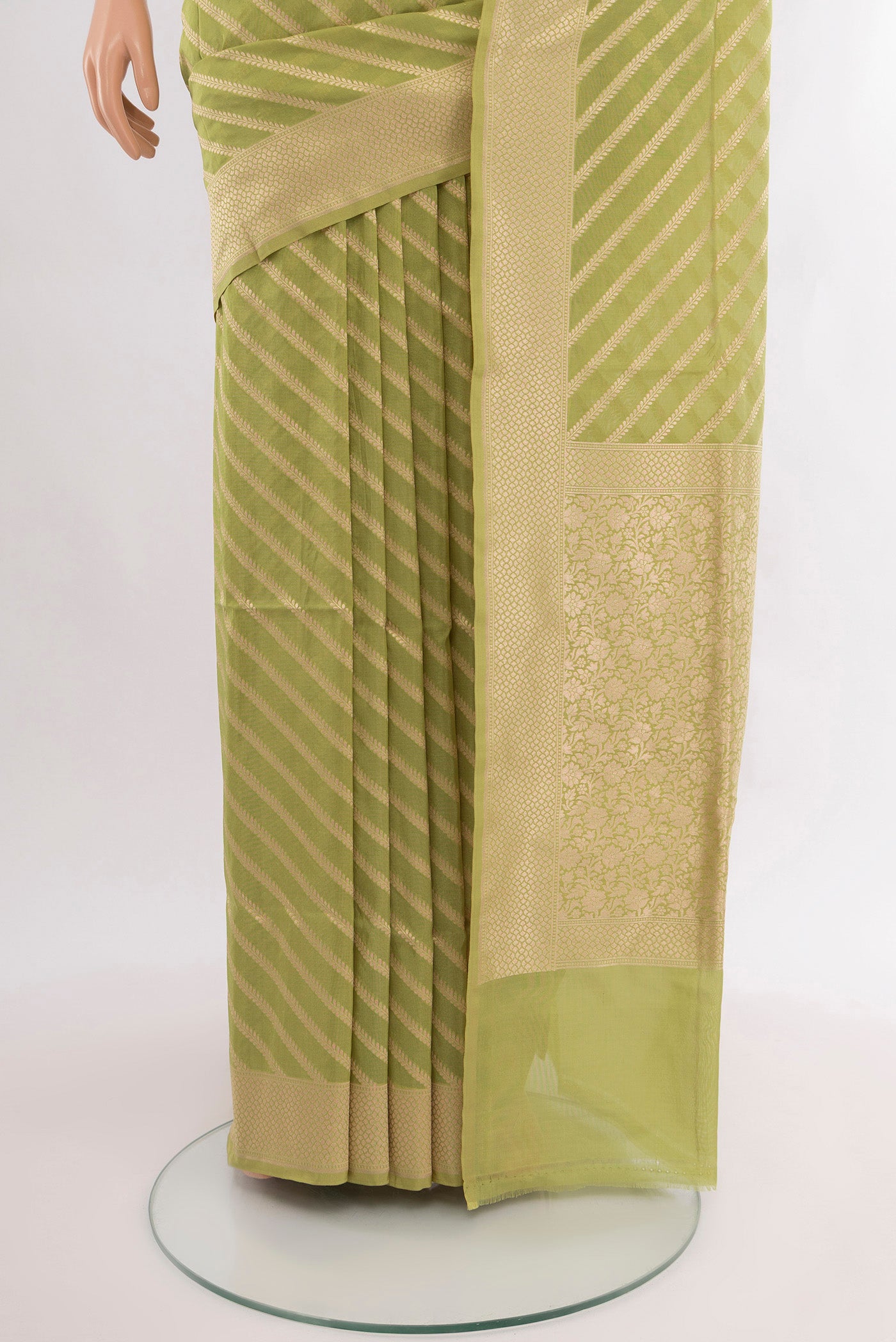 Pleats and pallu of Pure Silk Pure Zari Light Green Banarasi Saree with Zari Butta on the body and Silk Border. 