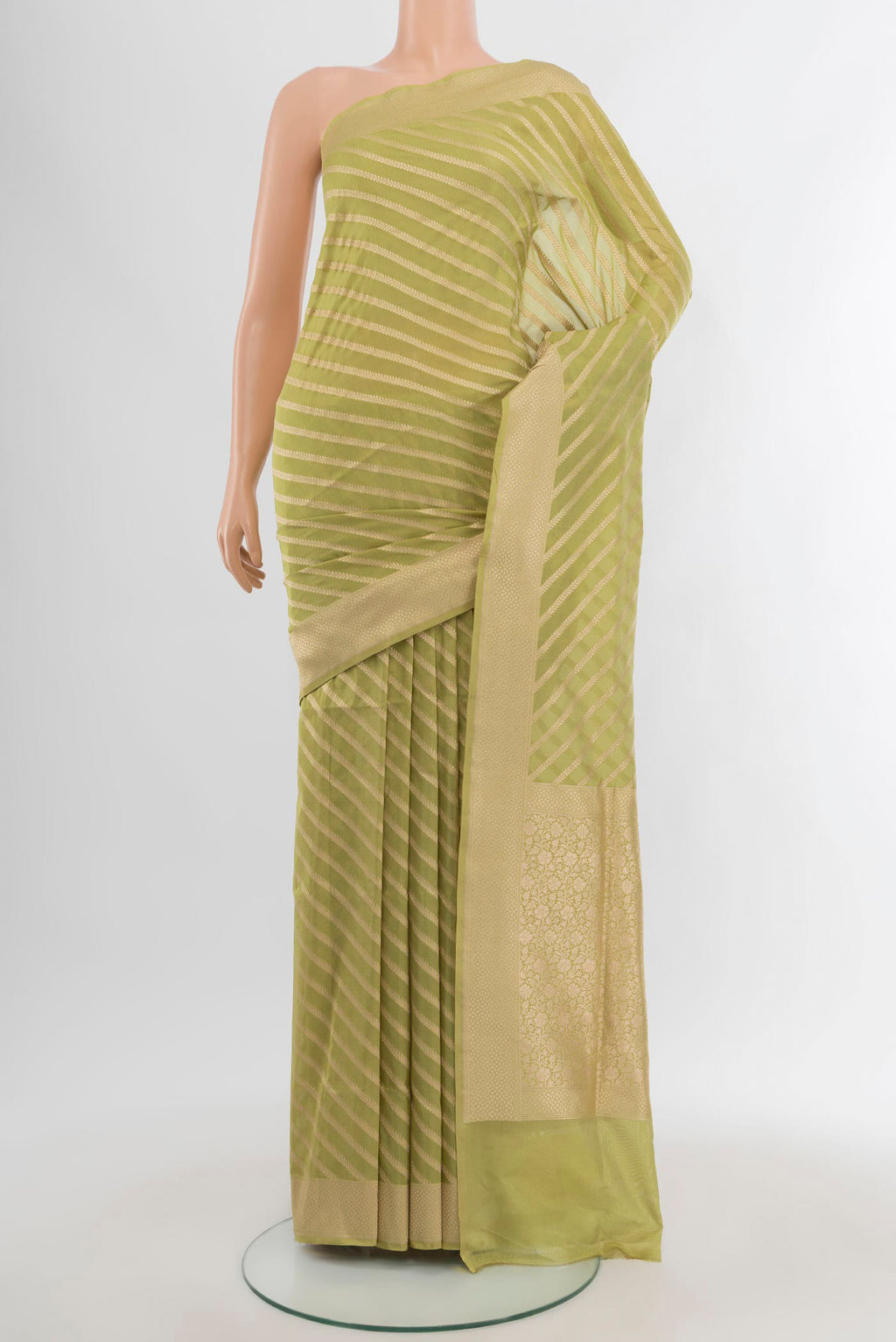 Pista Green Banarasi Silk Saree with Stripes on the body and Zari Border.  displayed on a mannequin