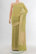 Pista Green Banarasi Silk Saree with Stripes on the body and Zari Border.  displayed on a mannequin