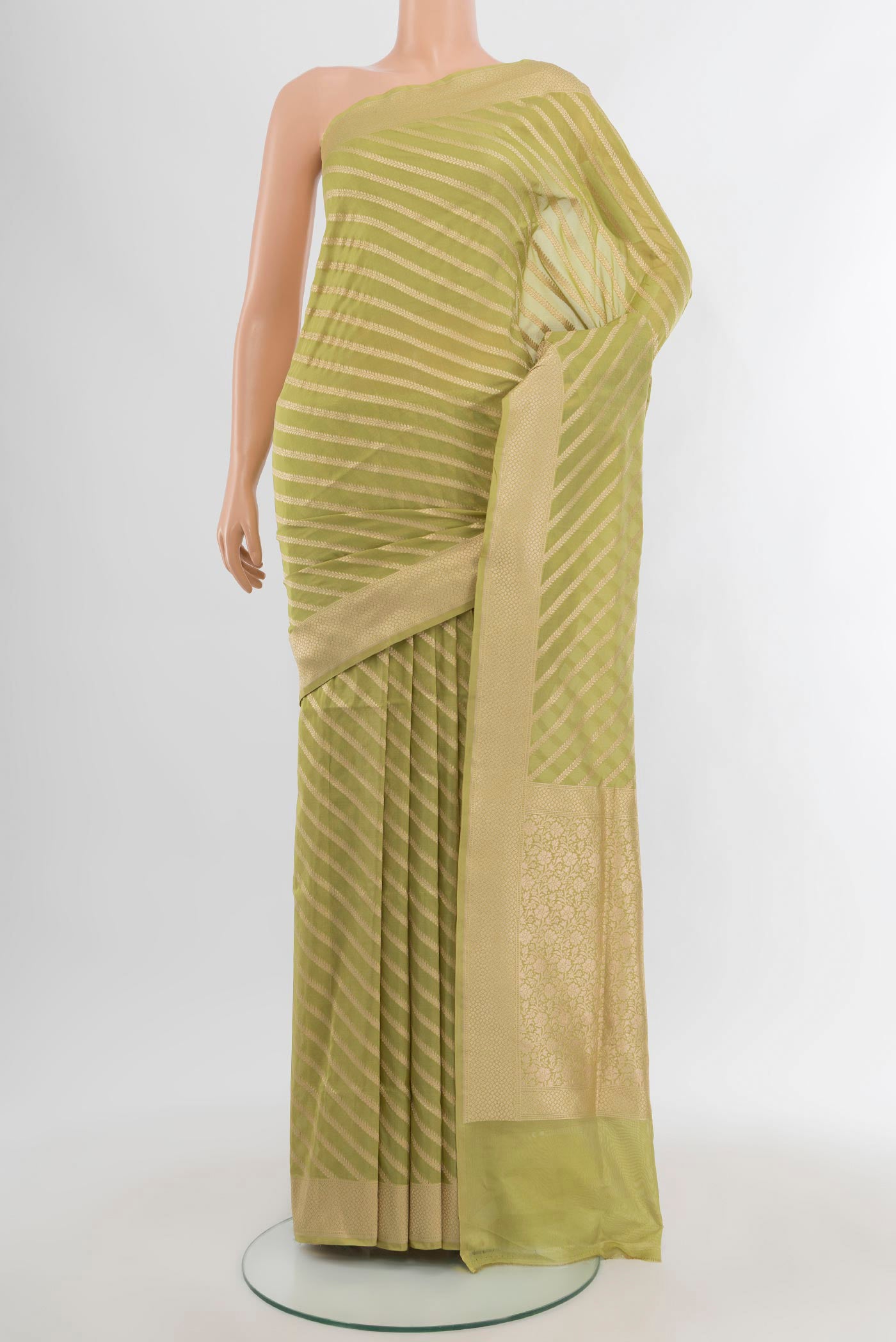 Pista Green Banarasi Silk Saree with Stripes on the body and Zari Border.  displayed on a mannequin