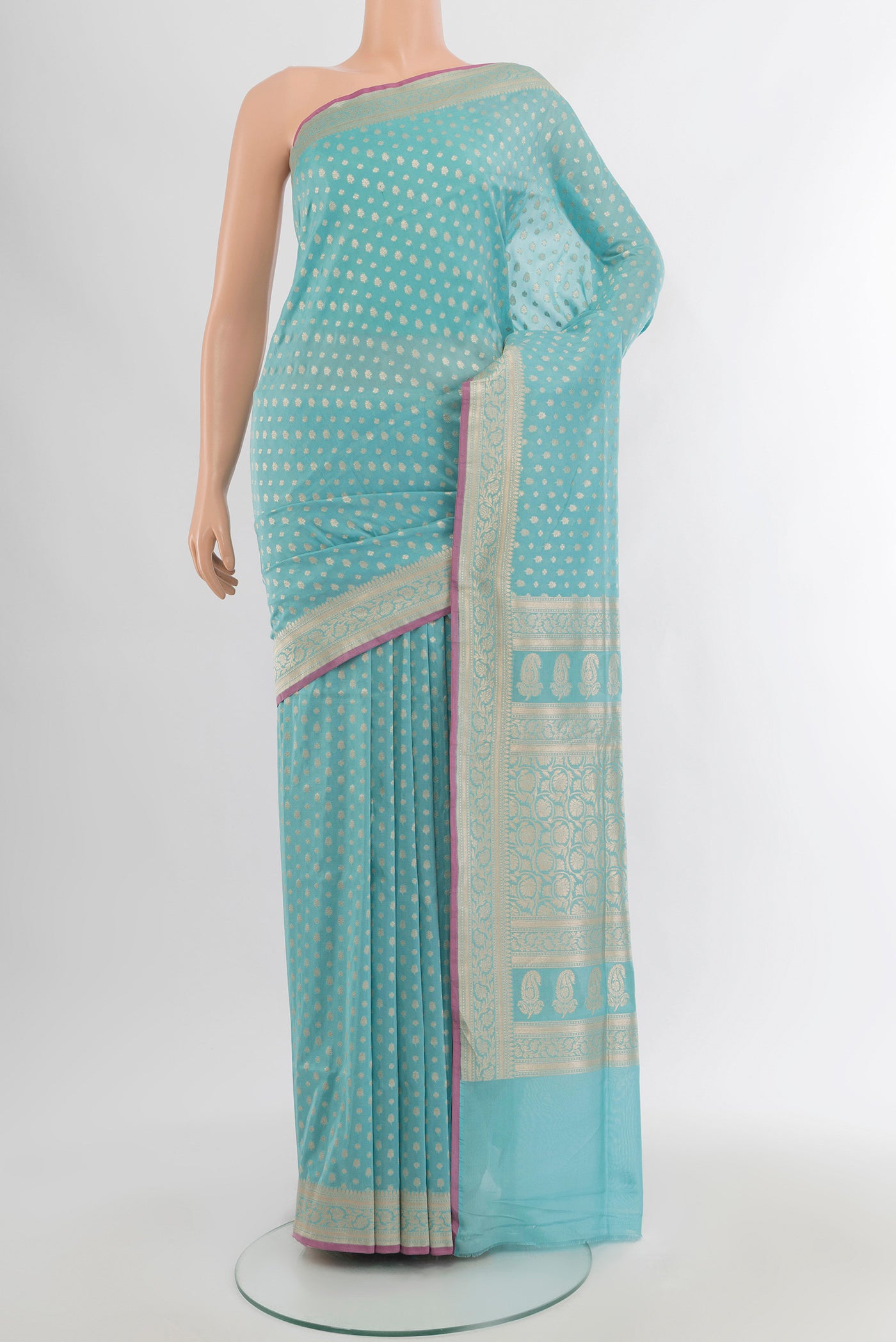 Sky Blue Banarasi Silk Saree with Zari Butta on the body and Zari Border.  displayed on a mannequin