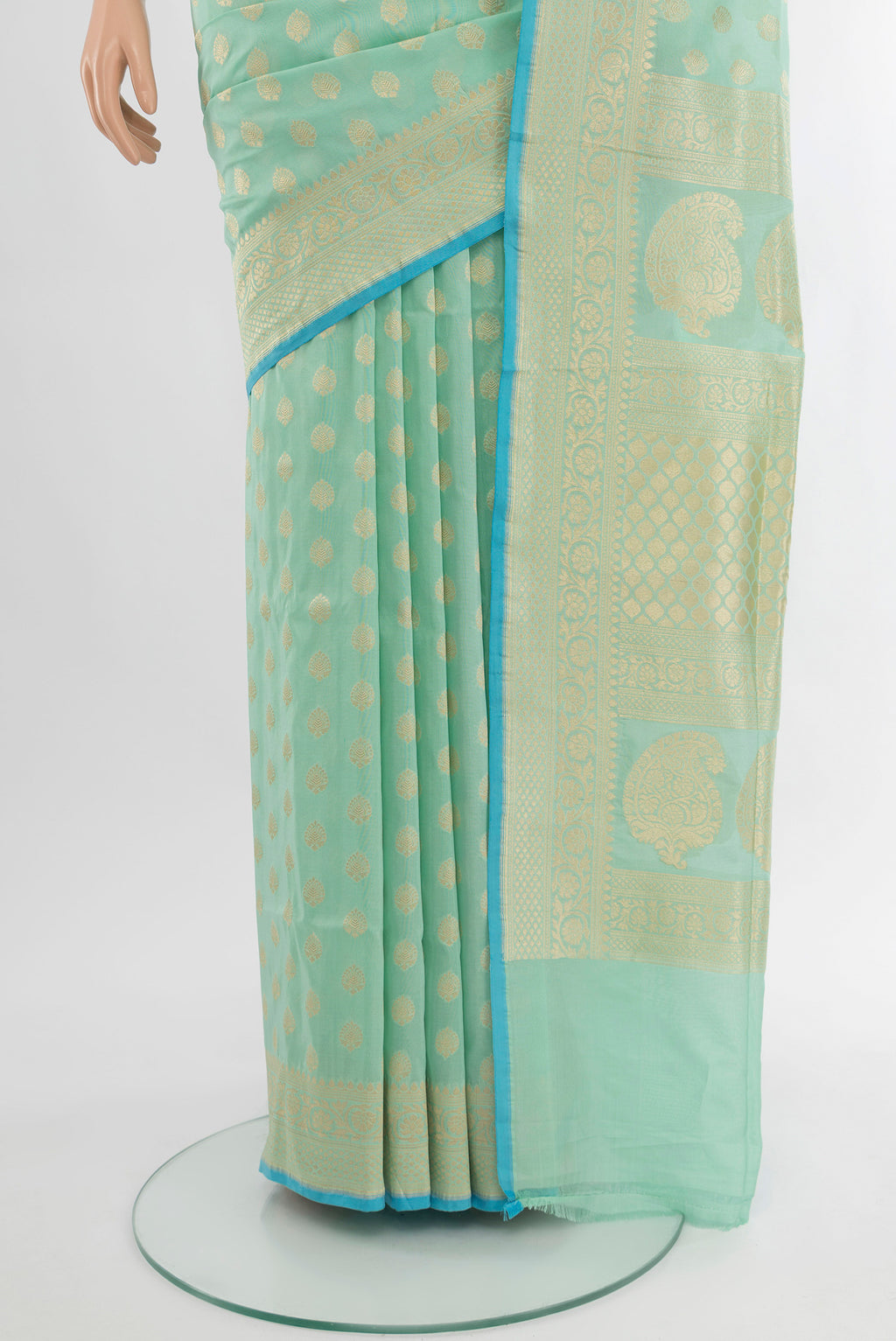 Pleats and pallu of Pure Silk Pure Zari Light Green Banarasi Saree with Zari Butta on the body and Silk Border. 