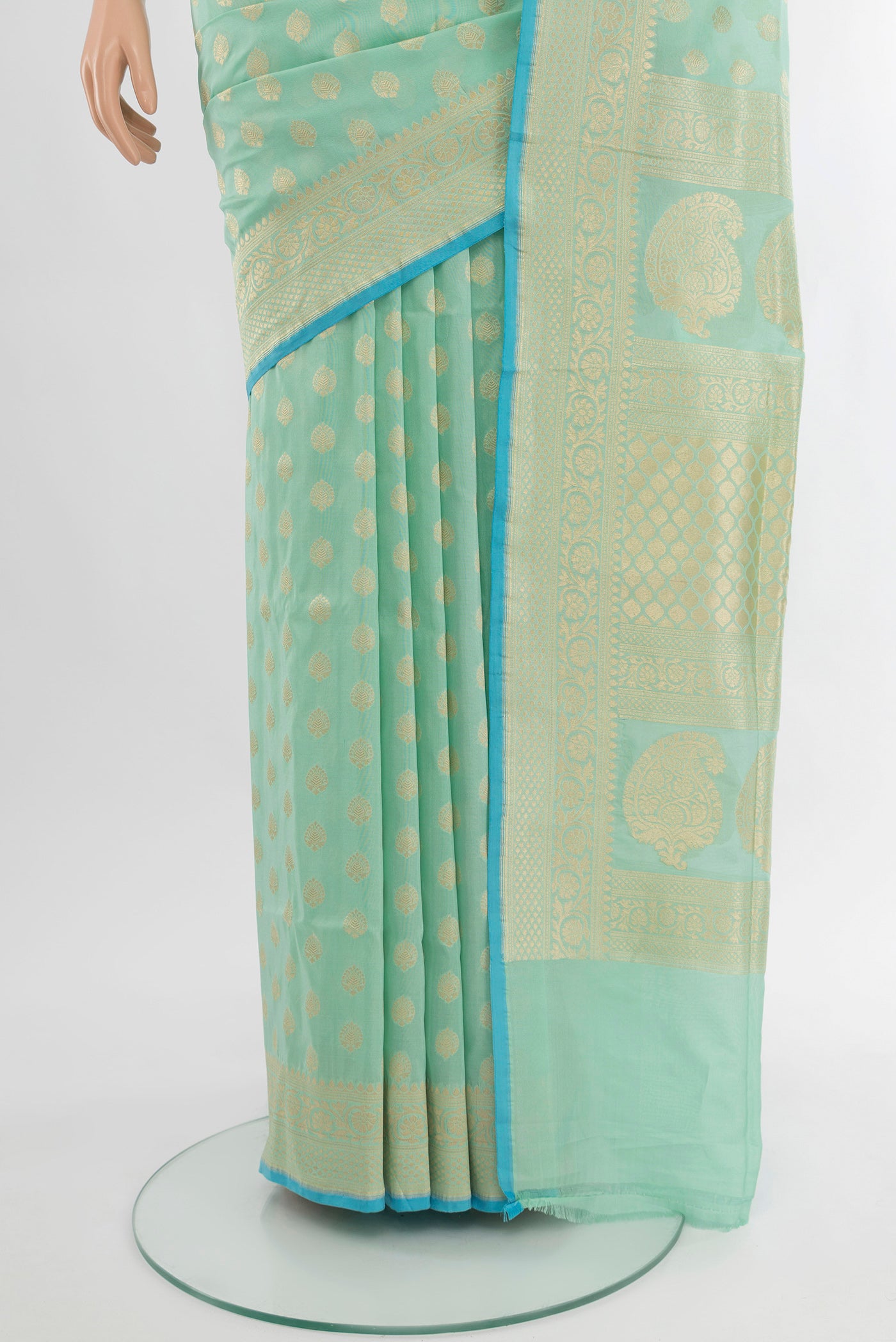 Pleats and pallu of Pure Silk Pure Zari Light Green Banarasi Saree with Zari Butta on the body and Silk Border. 