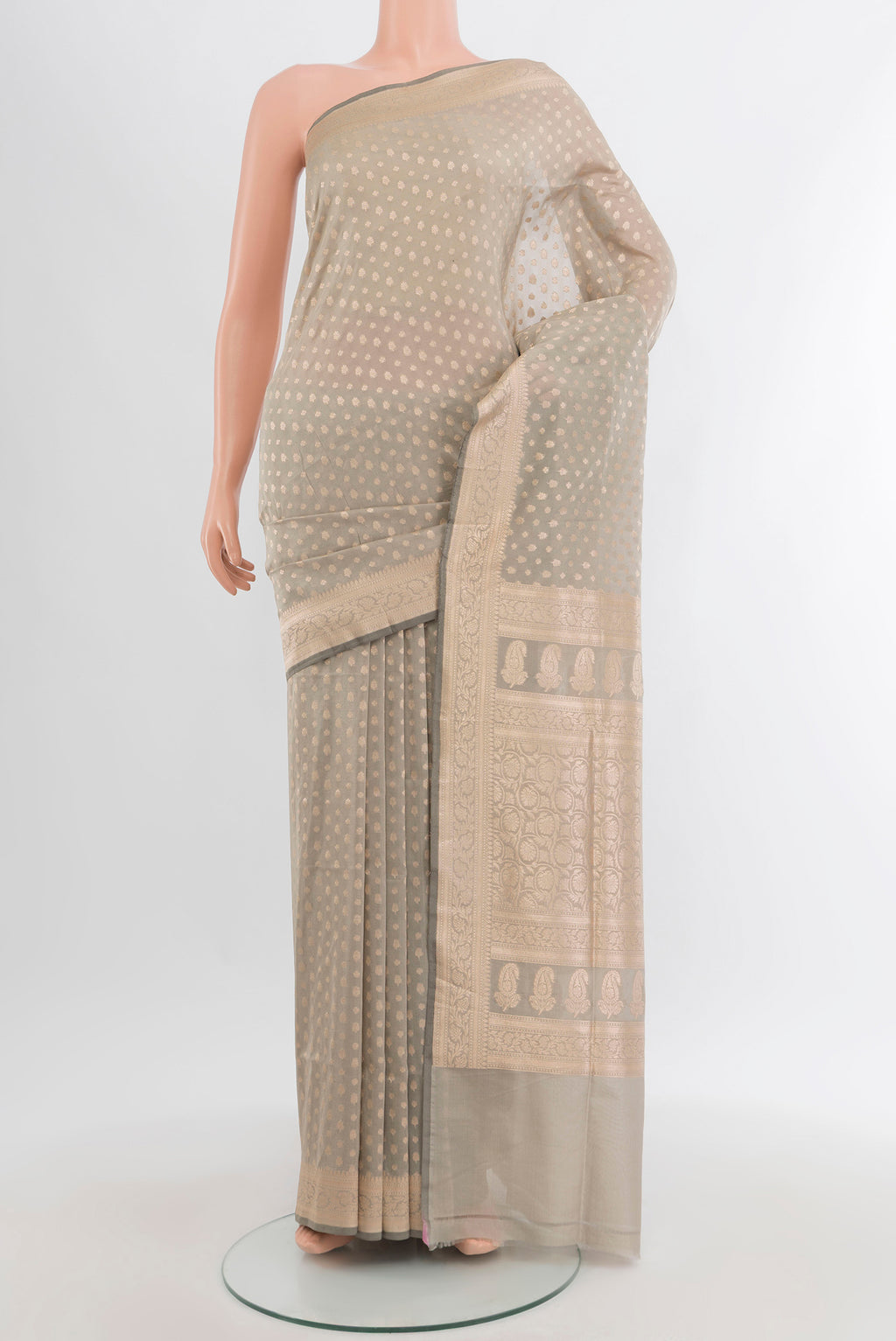 Davys Grey Banarasi Silk Saree with Zari Butta on the body and Zari Border.  displayed on a mannequin