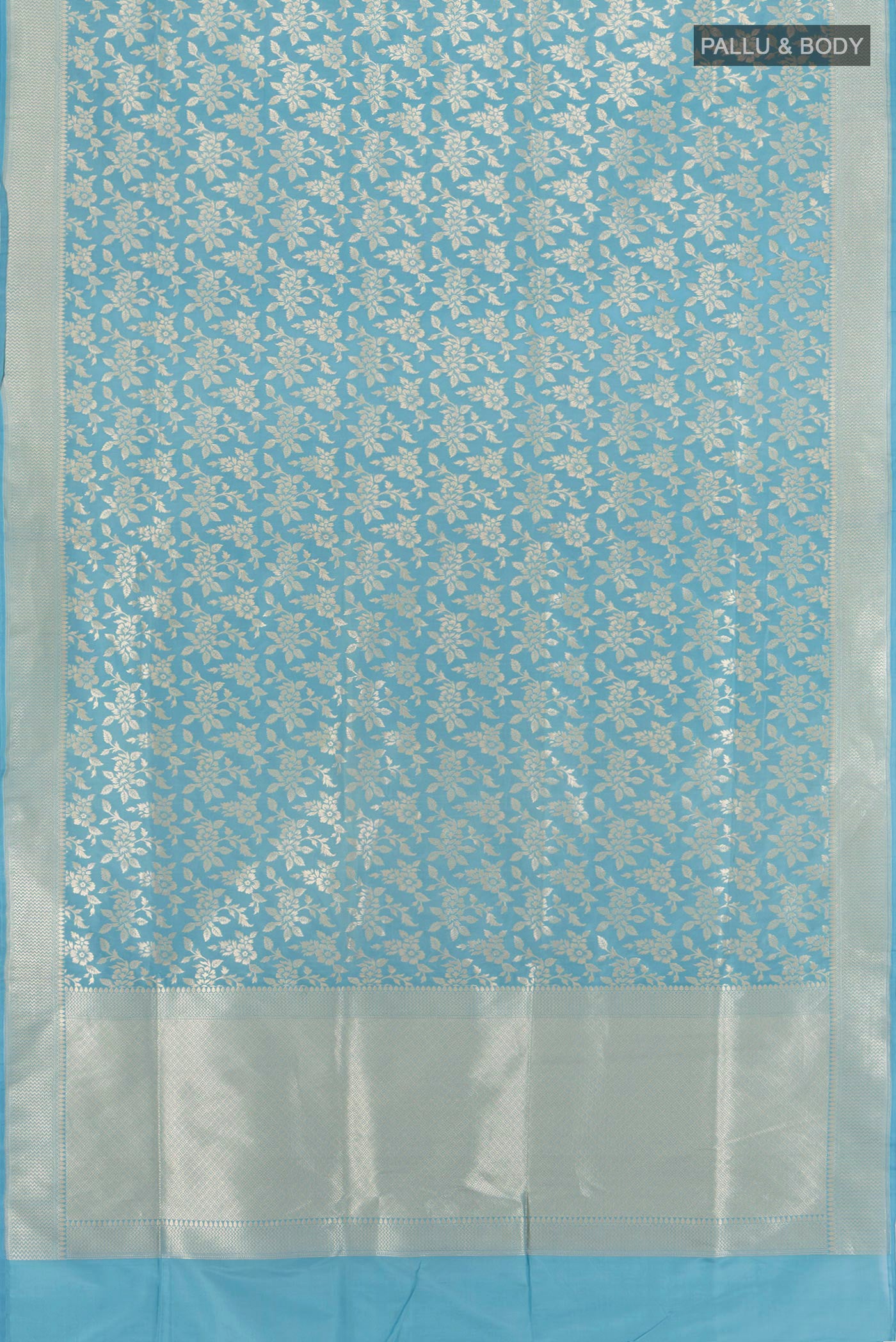 Flat view of Maya Blue Banarasi Silk Saree with Zari Brocade on the body and Zari Border. 