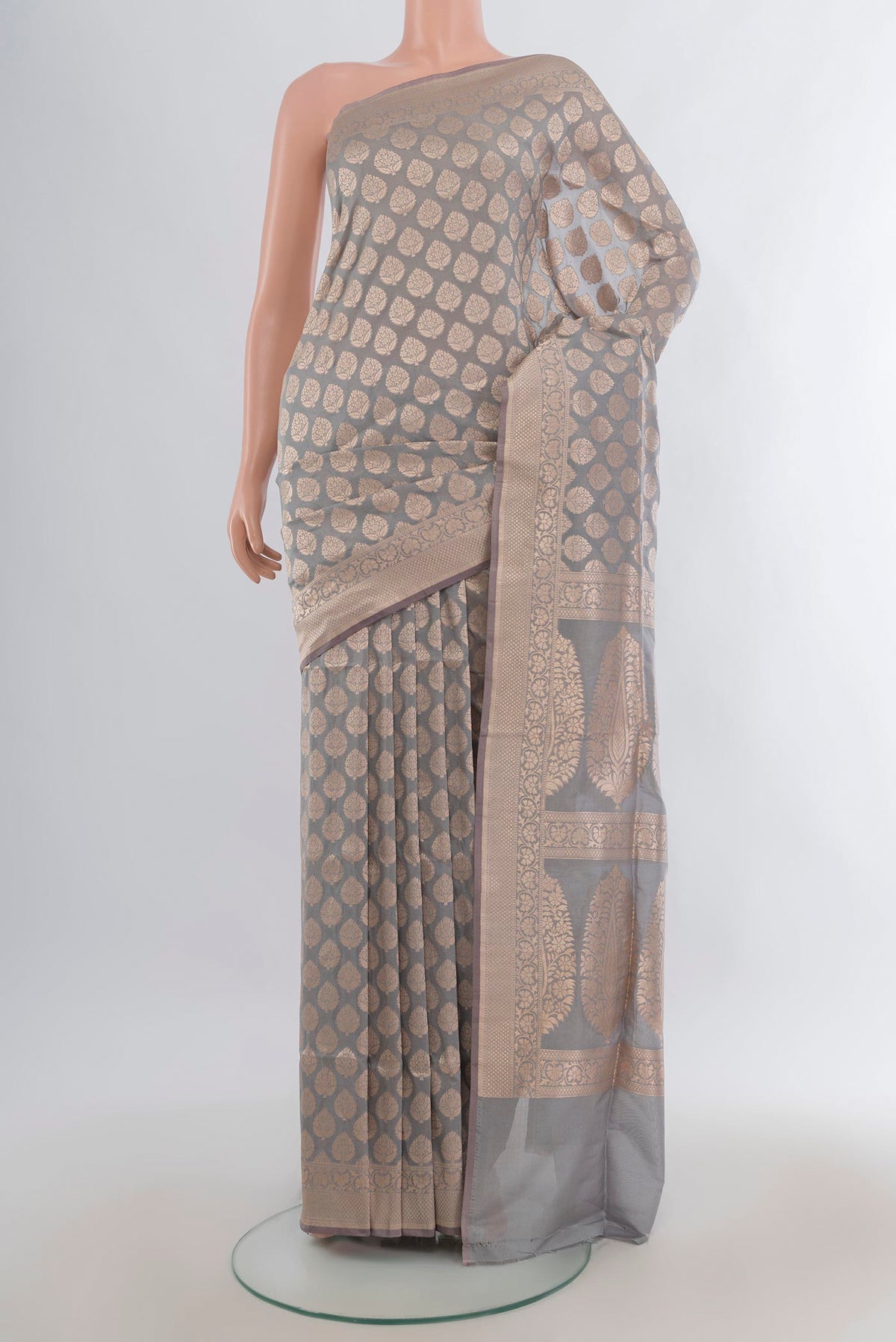 Pure Silk Grey Banarasi Saree with Zari Butta on the body and Zari Border.  displayed on a mannequin