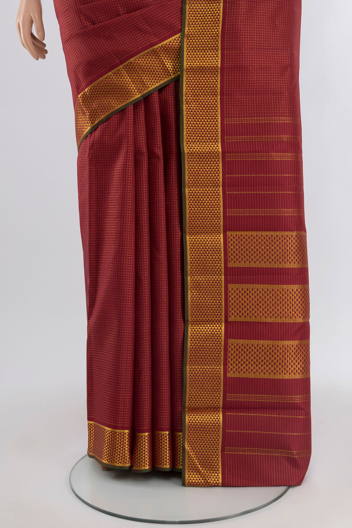 Pleats and pallu of Maroon Kanchipuram Silk Saree with Checked design on the body and Zari Border. 