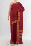Pure Silk Maroon Kanchipuram Saree with Checked design on the body and Zari Border.  displayed on a mannequin