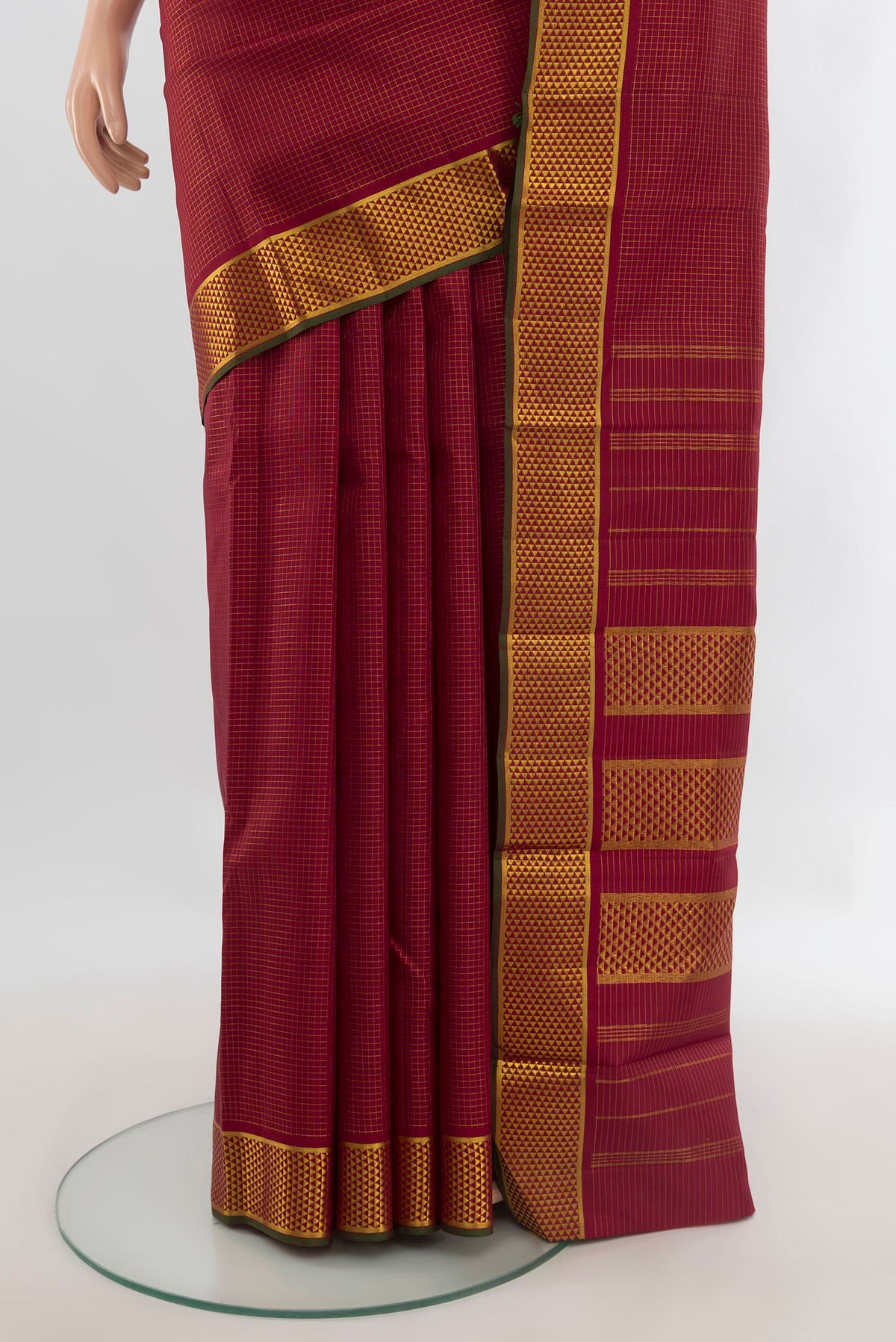 Pleats and pallu of Pure Silk Maroon Kanchipuram Saree with Checked design on the body and Zari Border. 