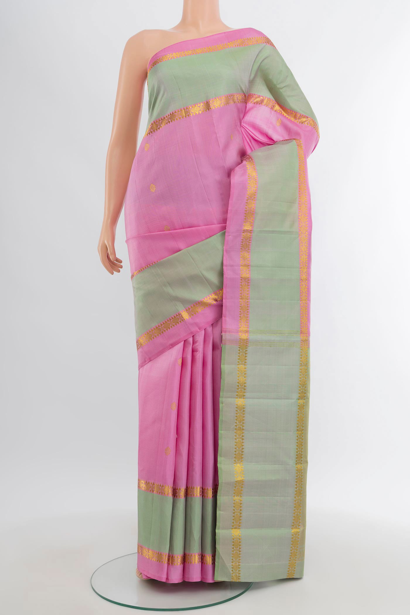 Rose pink Kanjivaram Silk Saree with Zari Butta on the body and Plain Border.  displayed on a mannequin