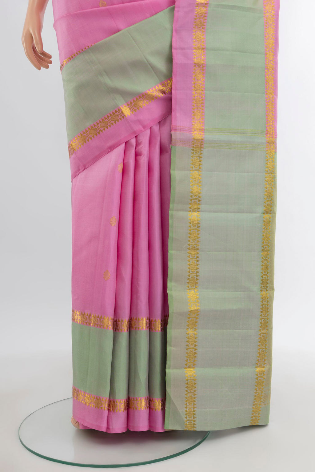 Pleats and pallu of Rose pink Kanjivaram Silk Saree with Zari Butta on the body and Plain Border. 