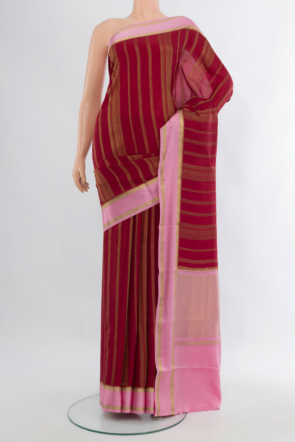 Maroon Mysore Crepe Saree with Stripes on the body and Zari Border.  displayed on a mannequin