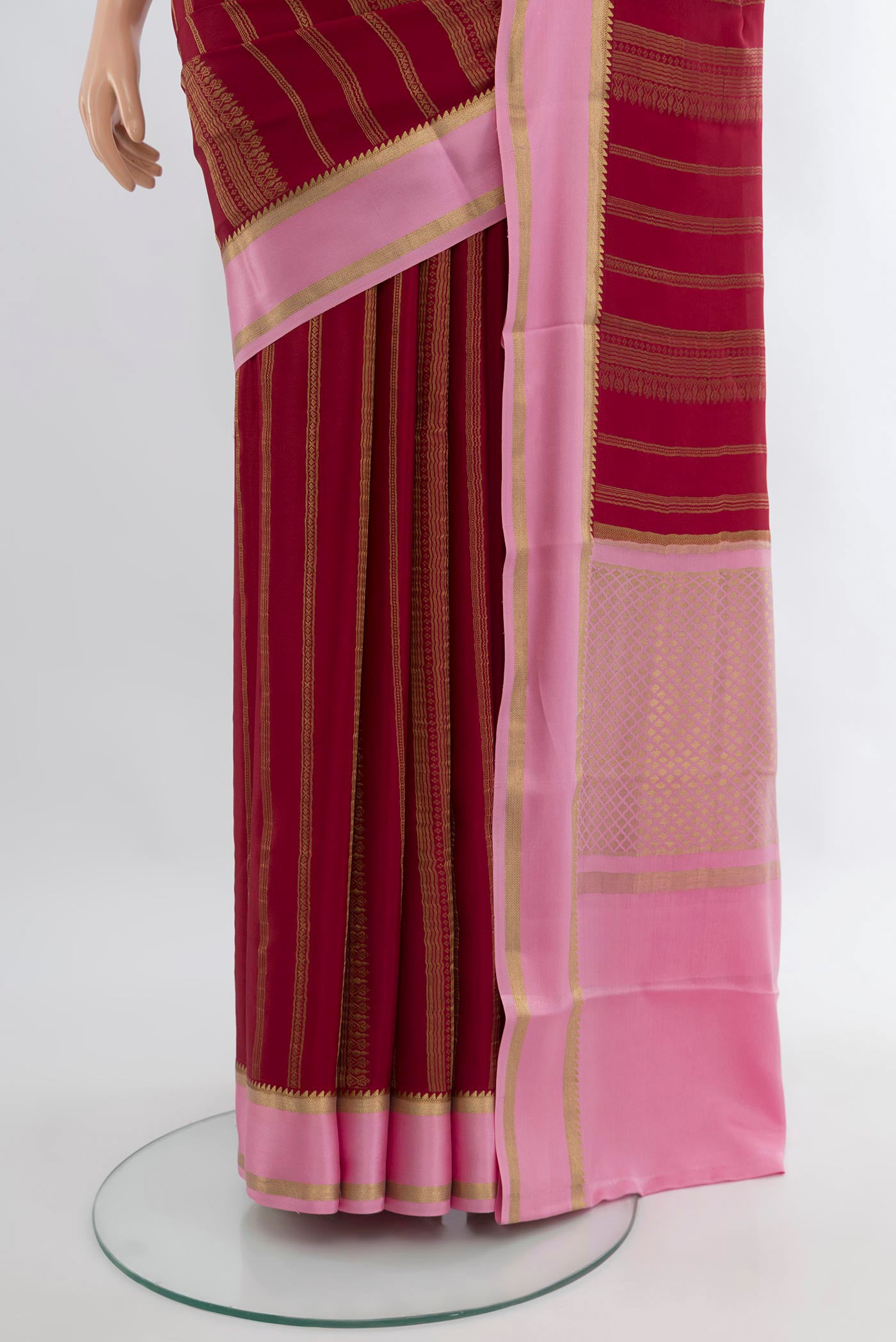 Pleats and pallu of Maroon Mysore Crepe Saree with Stripes on the body and Zari Border. 