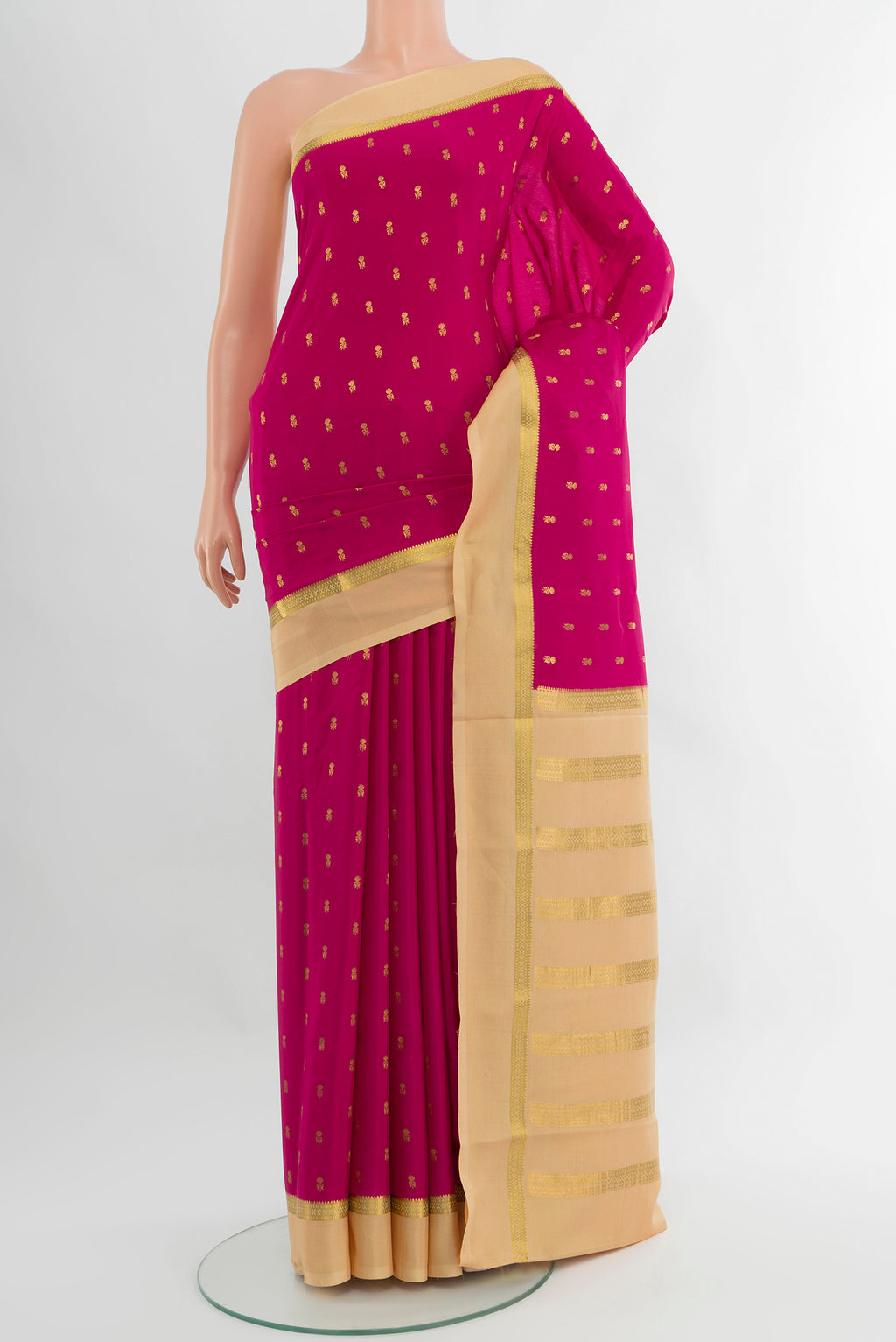 Magenta Mysore Crepe Saree with Zari Butta on the body and Zari Border.  displayed on a mannequin