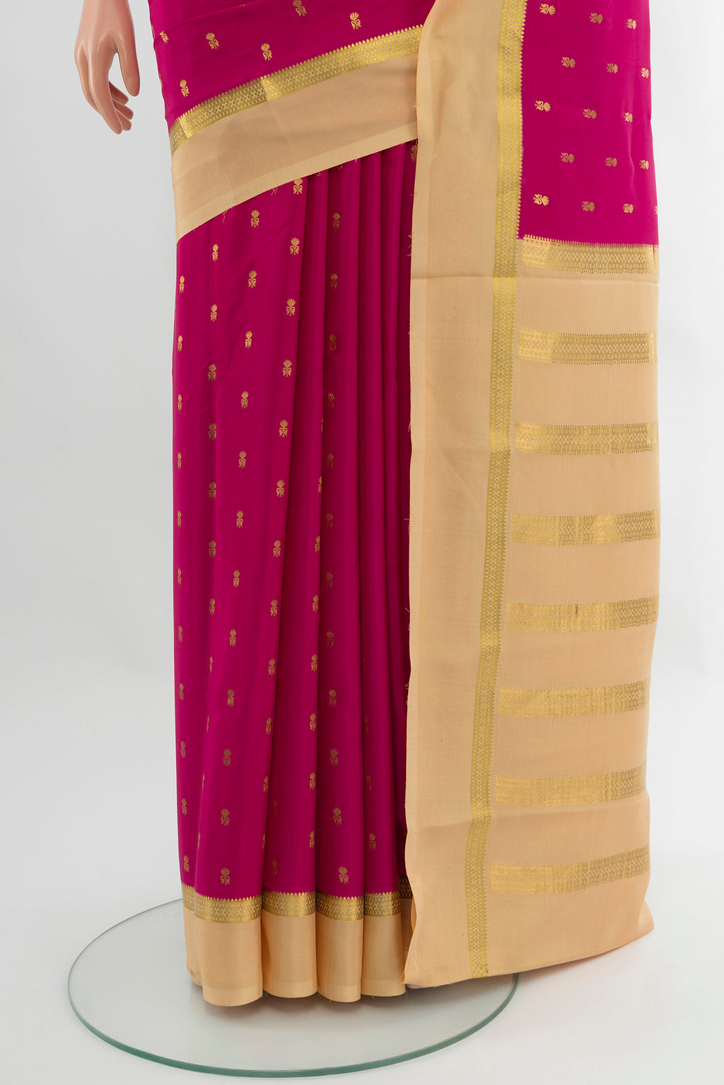 Pleats and pallu of Magenta Mysore Crepe Saree with Zari Butta on the body and Zari Border. 