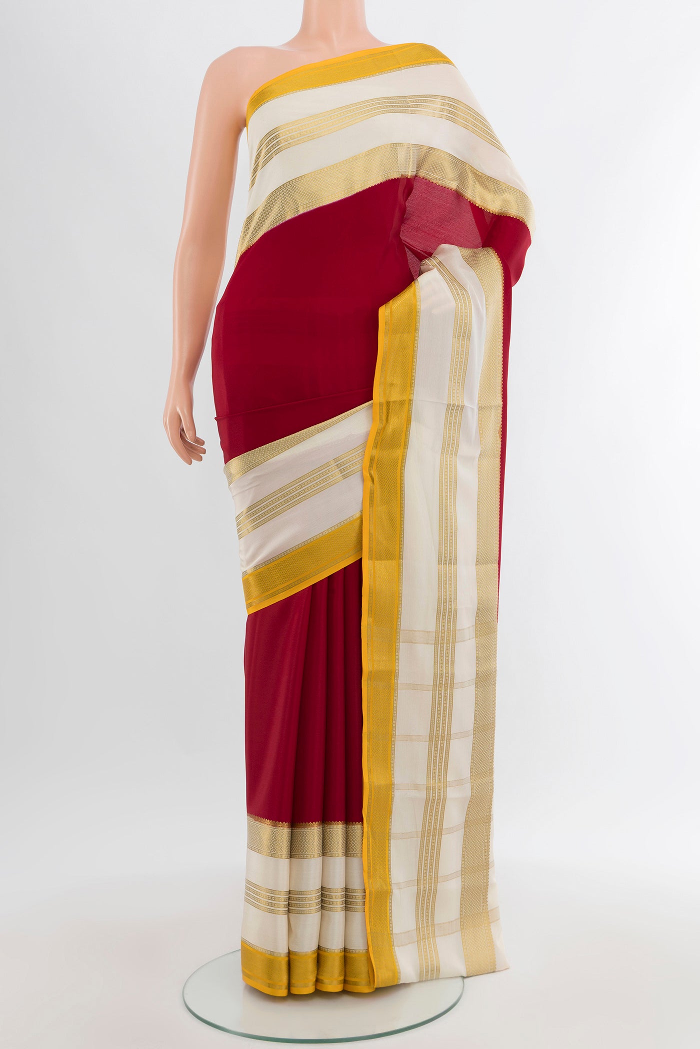 Maroon Mysore Crepe Saree with Plain Body and Zari Border.  displayed on a mannequin