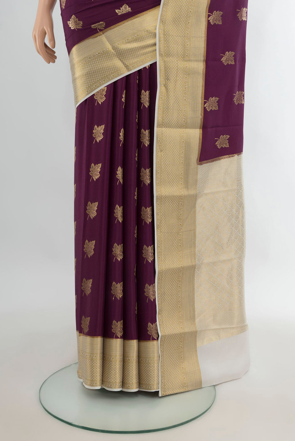 Pleats and pallu of Purple Mysore Crepe Saree with Zari Butta on the body and Zari Border. 