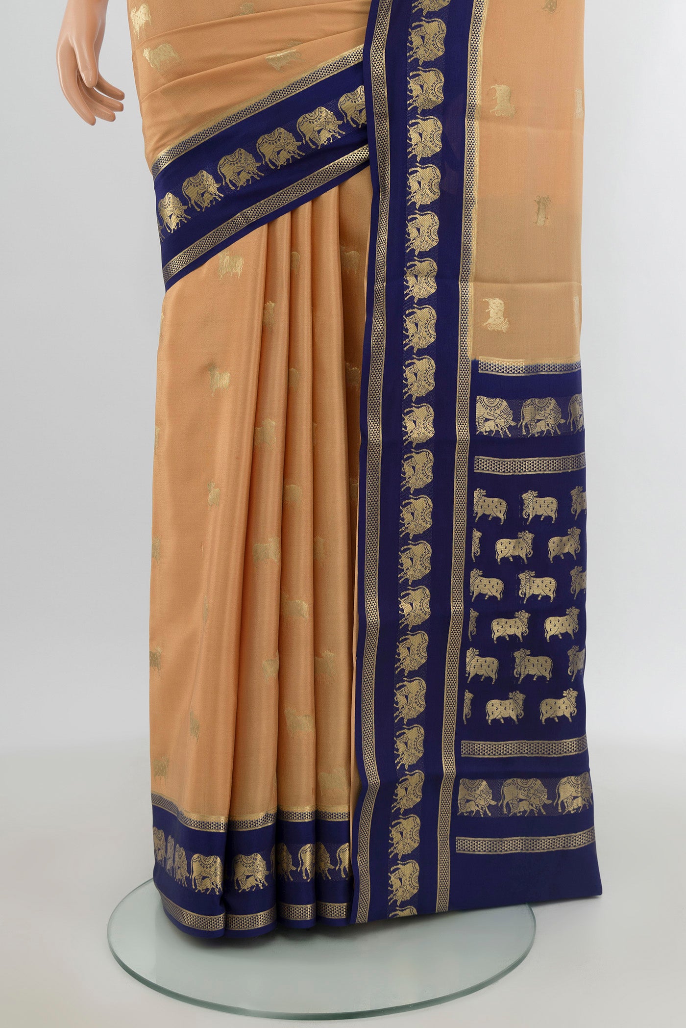 Pleats and pallu of Sandal Mysore Crepe Saree with Zari Butta on the body and Zari Border. 