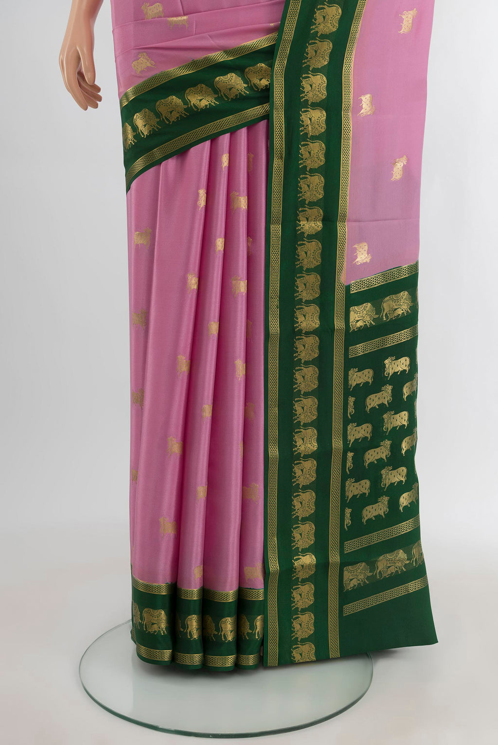 Pleats and pallu of Rose pink Mysore Crepe Saree with Zari Butta on the body and Zari Border. 