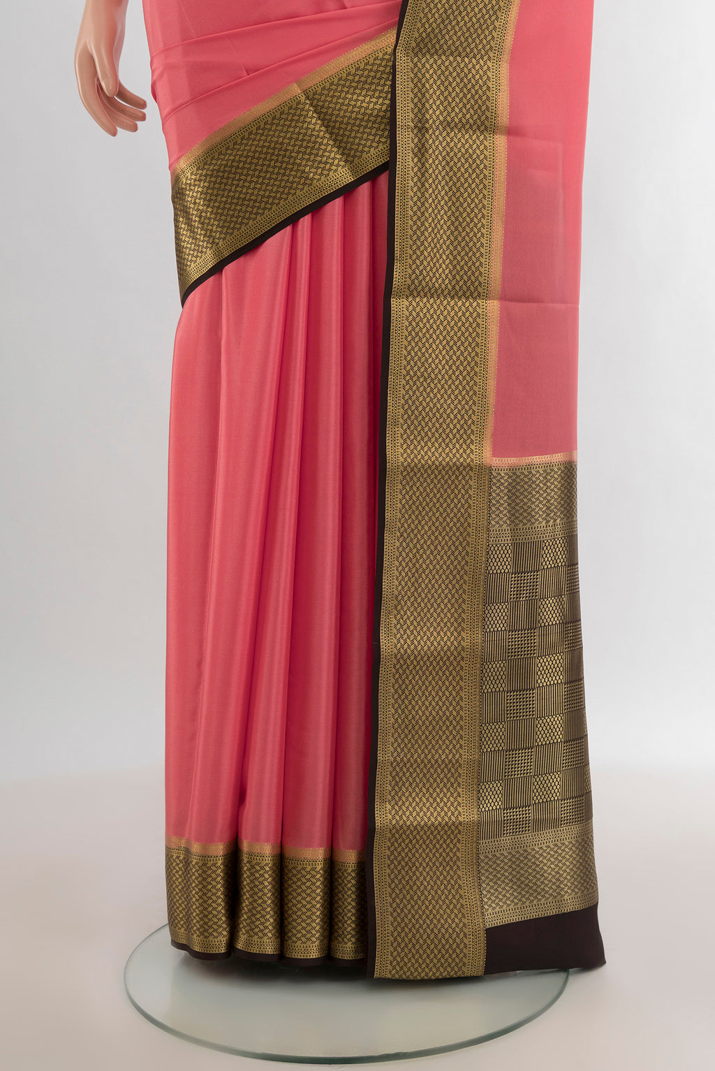 Pleats and pallu of Rose pink Mysore Crepe Saree with Plain Body and Zari Border. 