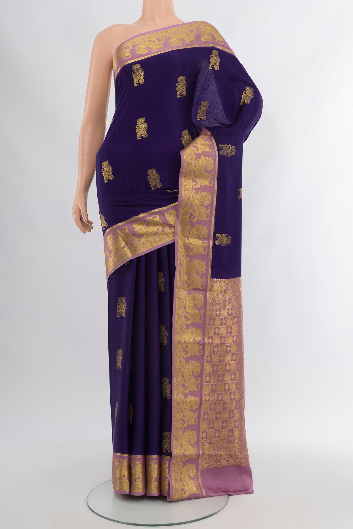 Navy Blue Mysore Crepe Saree with Zari Butta on the body and Zari Border.  displayed on a mannequin
