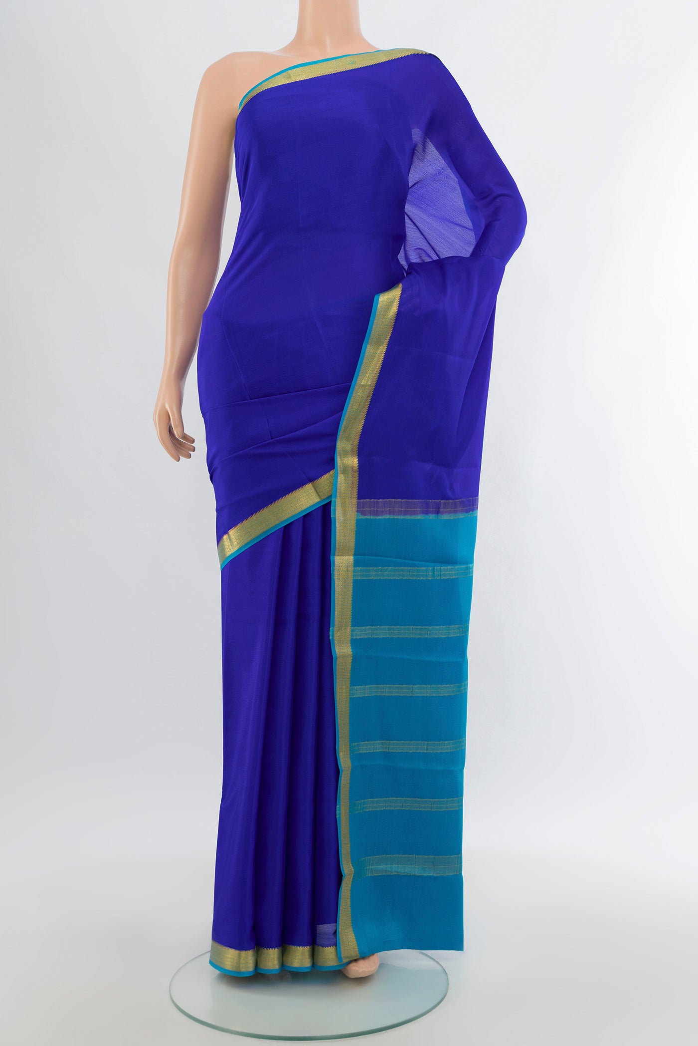 Royal Blue Mysore Crepe Saree with Plain Body and Zari Border.  displayed on a mannequin