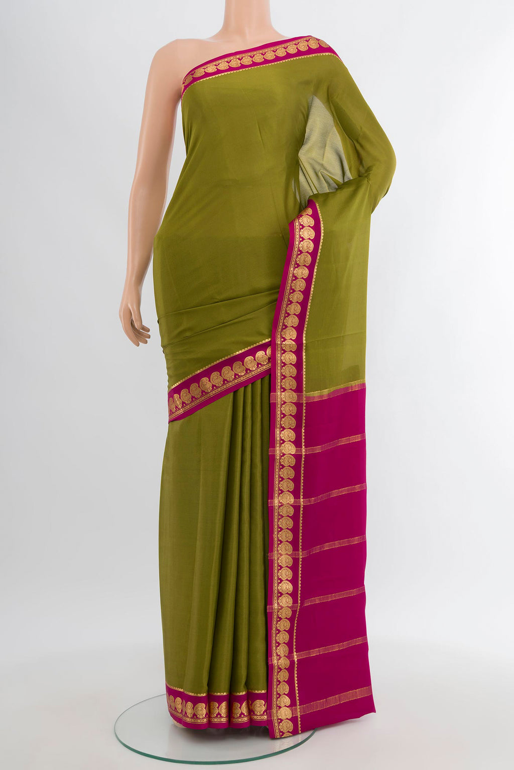 Mehandi Green Mysore Crepe Saree with Plain Body and Zari Border.  displayed on a mannequin
