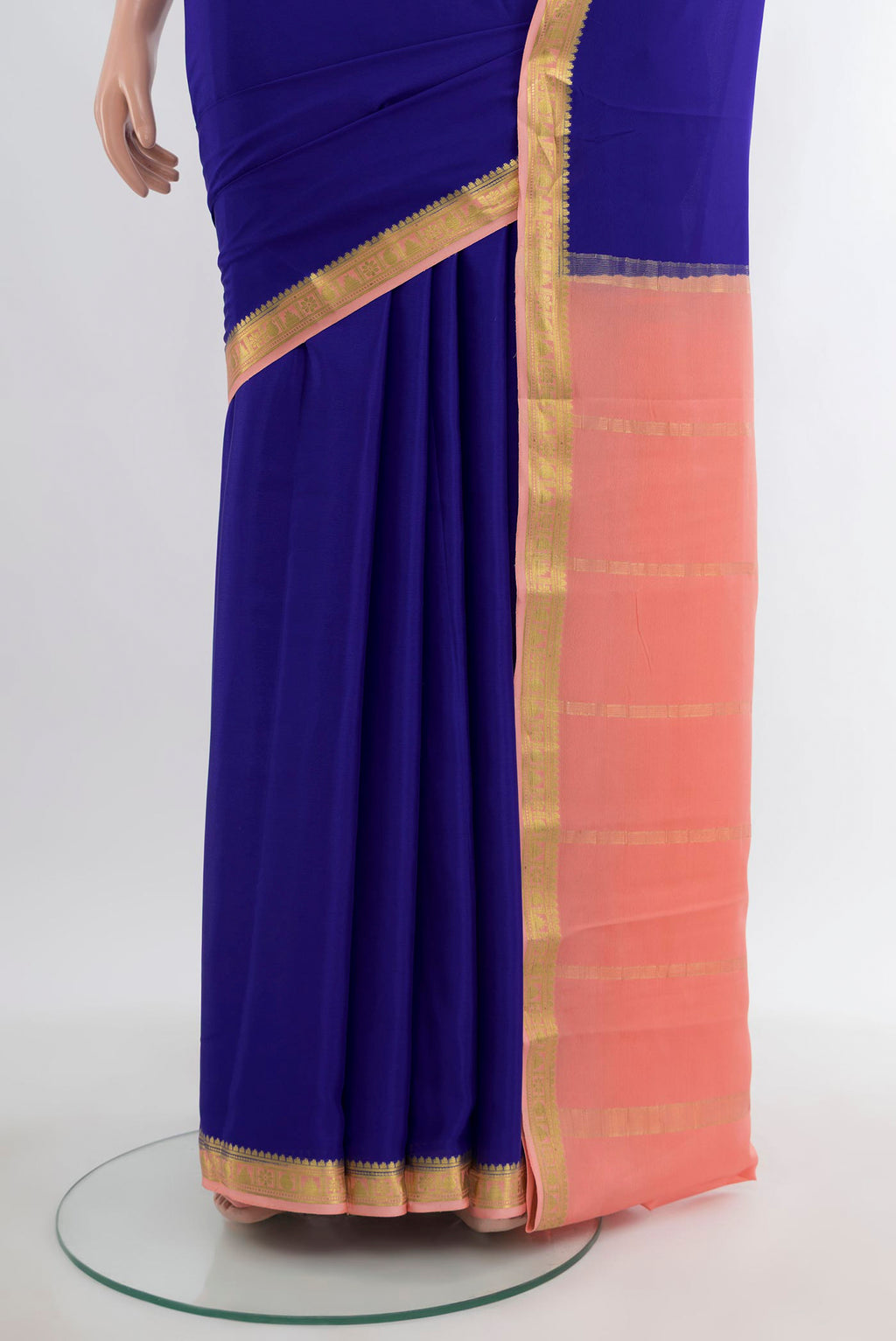 Pleats and pallu of Dark Blue Mysore Crepe Saree with Plain Body and Zari Border. 