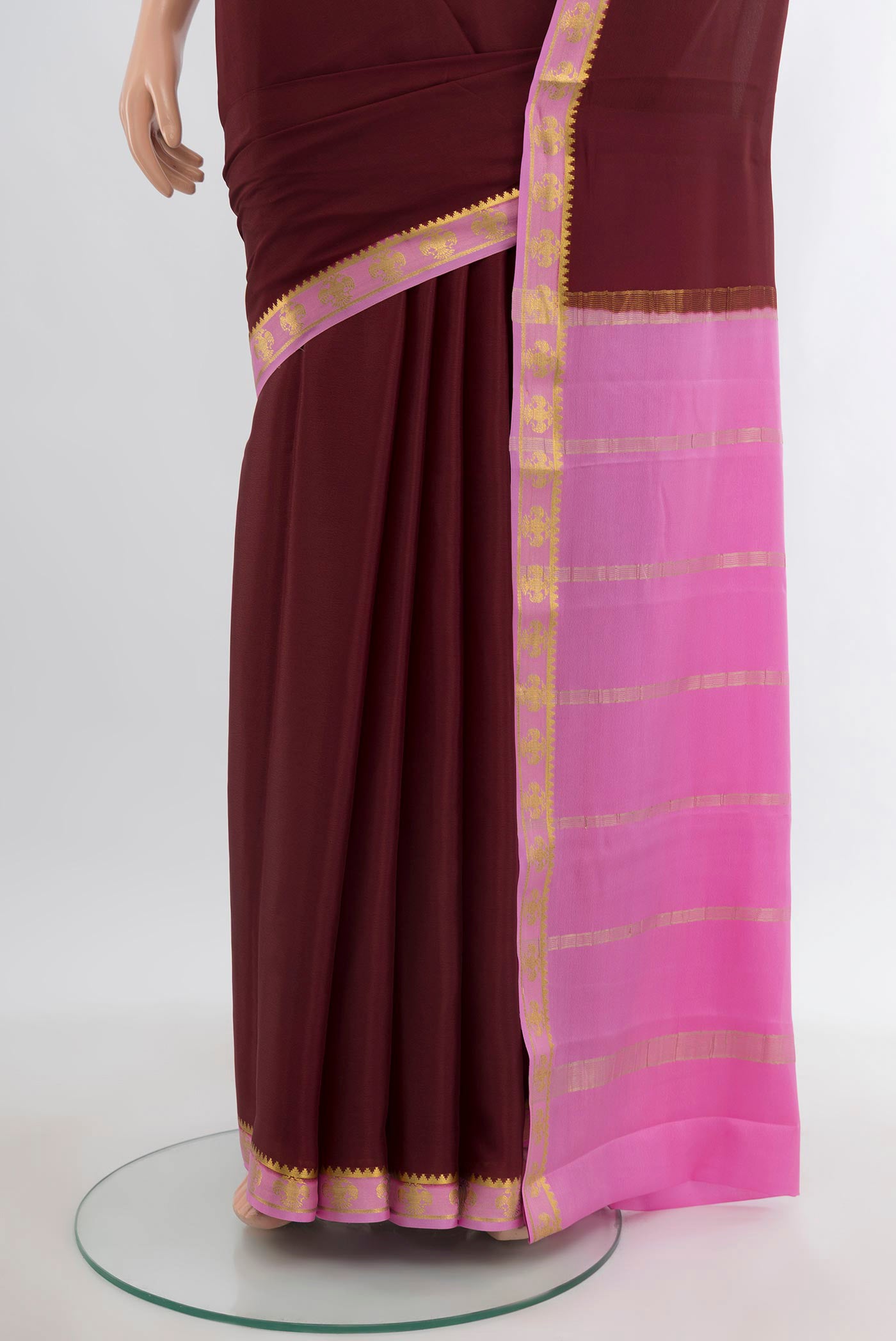 Pleats and pallu of Coffee Brown Mysore Crepe Saree with Plain Body and Zari Border. 