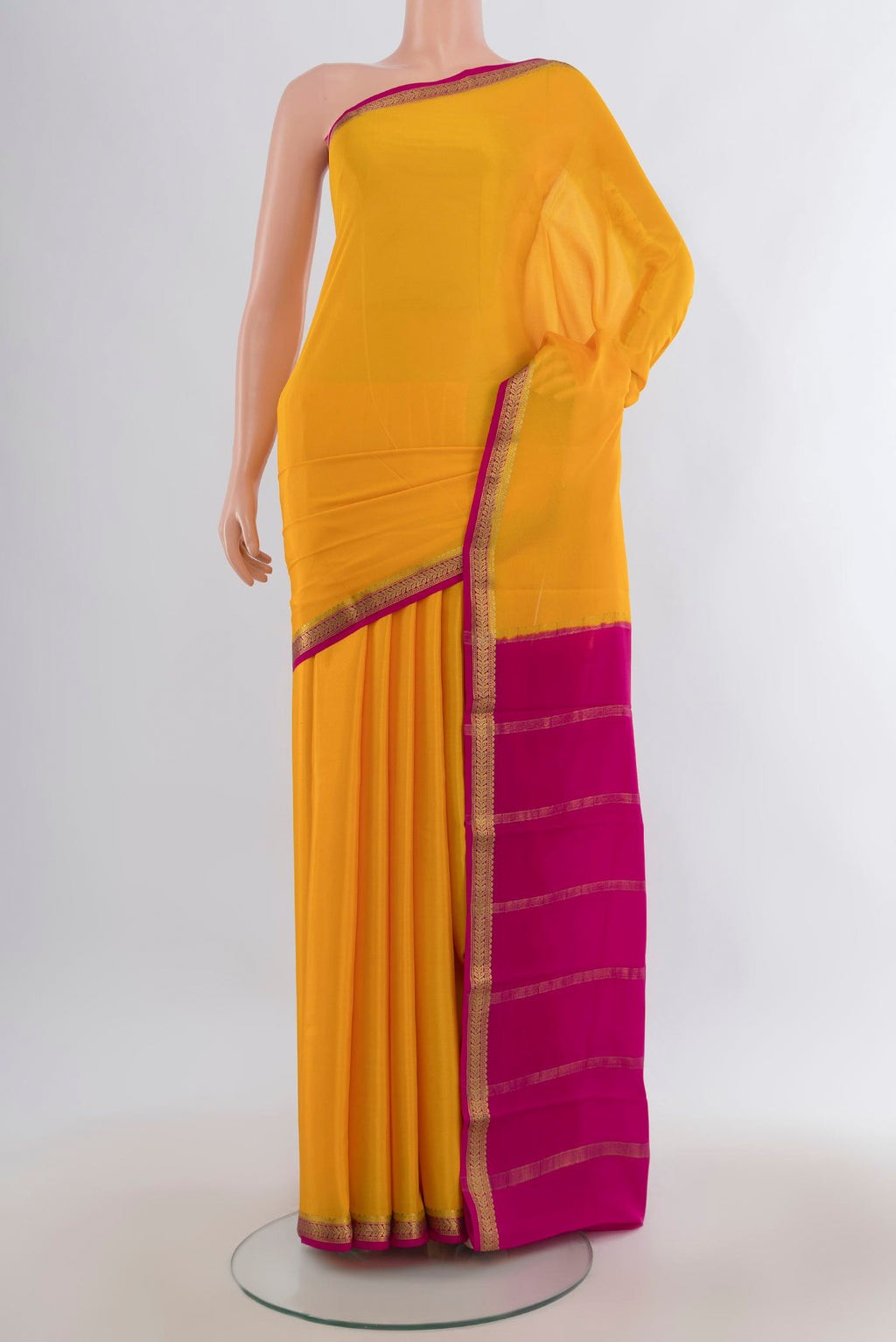Yellow Mysore Crepe Saree with Plain Body and Zari Border.  displayed on a mannequin