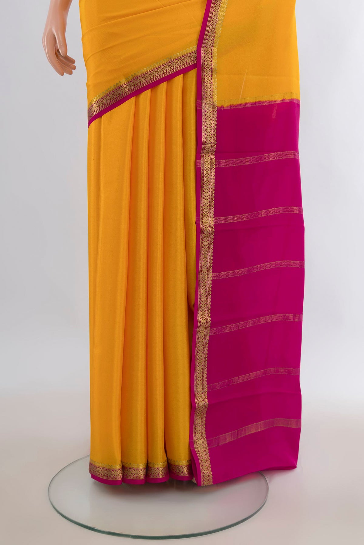 Pleats and pallu of Yellow Mysore Crepe Saree with Plain Body and Zari Border. 