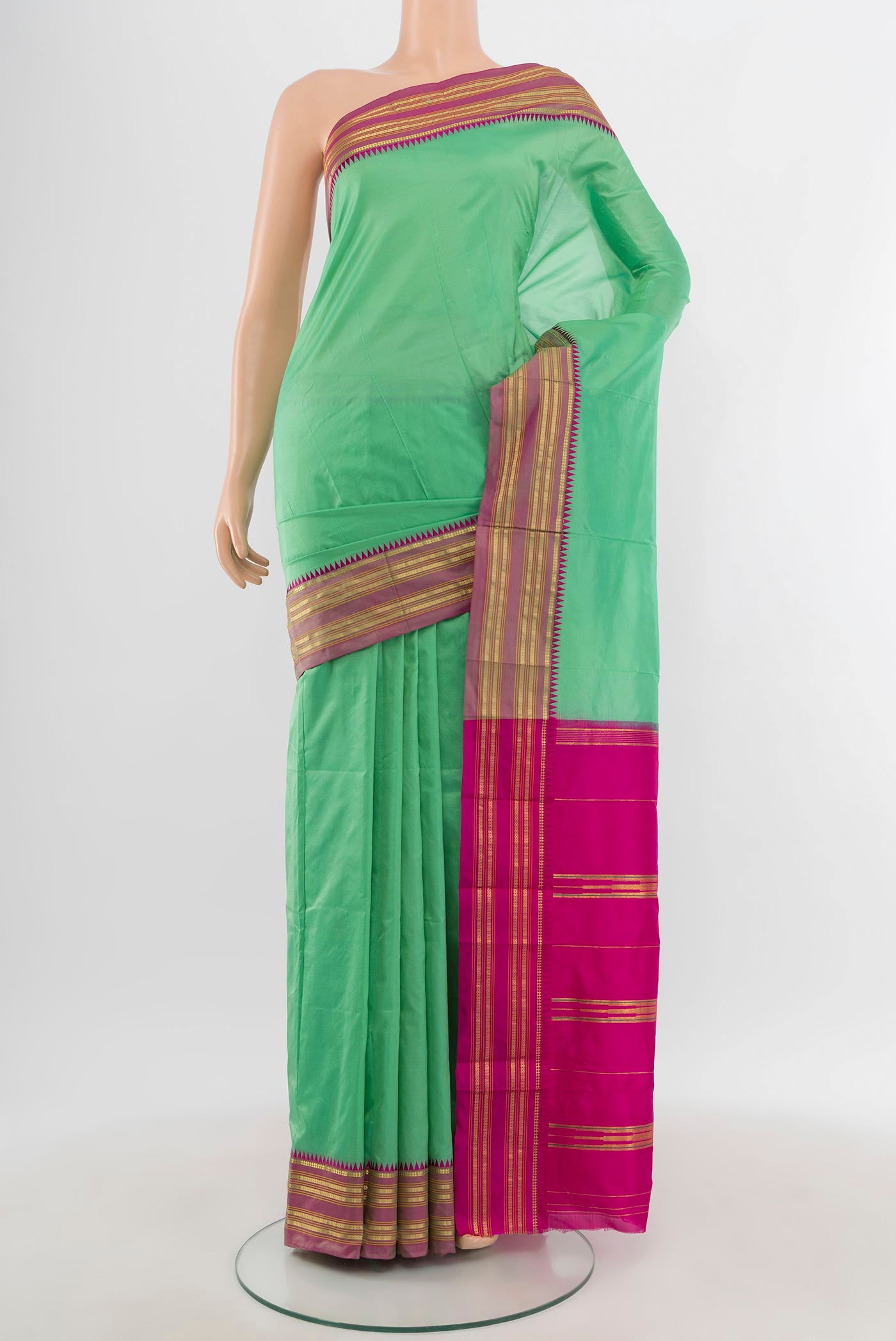 Sea Green Narayanpet Silk Saree with Plain Body and Zari Border.  displayed on a mannequin