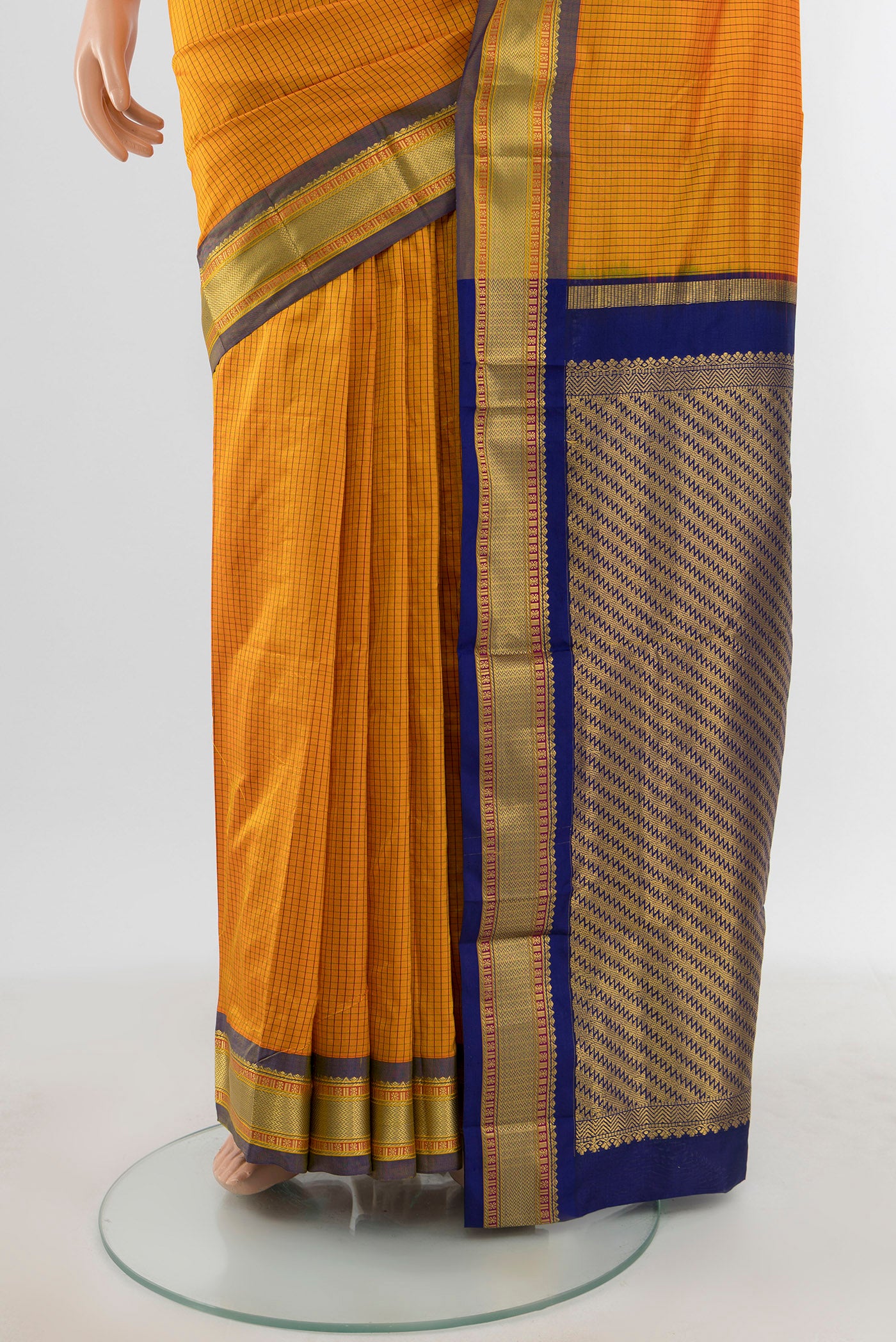 Pleats and pallu of Yellow Narayanpet Silk Saree with Checked design on the body and Zari Border. 