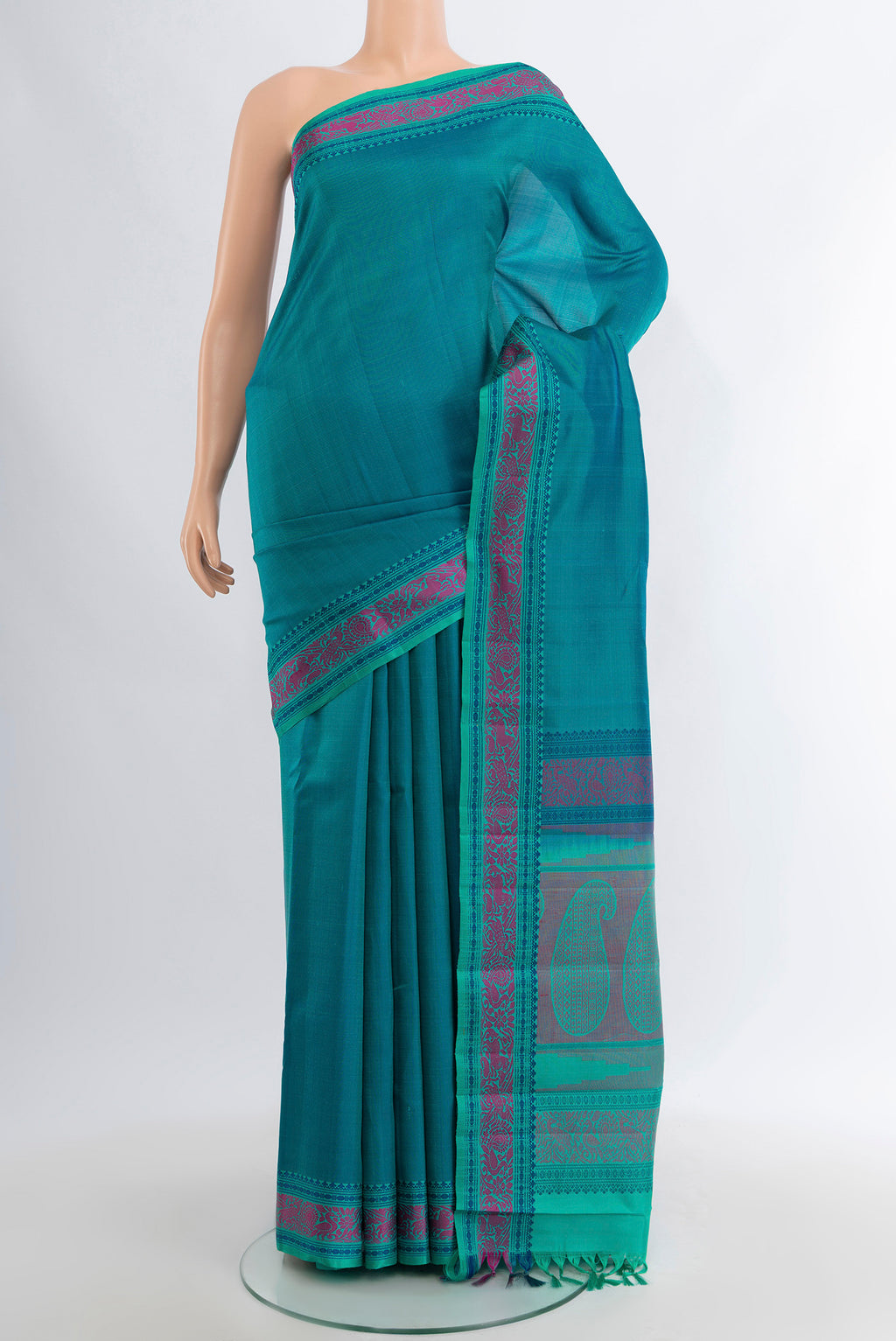 Peacock Blue Kanchipuram Silk Saree with Plain Body and Thread Border.  displayed on a mannequin
